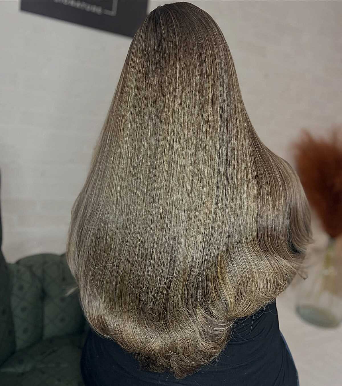 Long olive ash brown balayage with flipped blowout ends