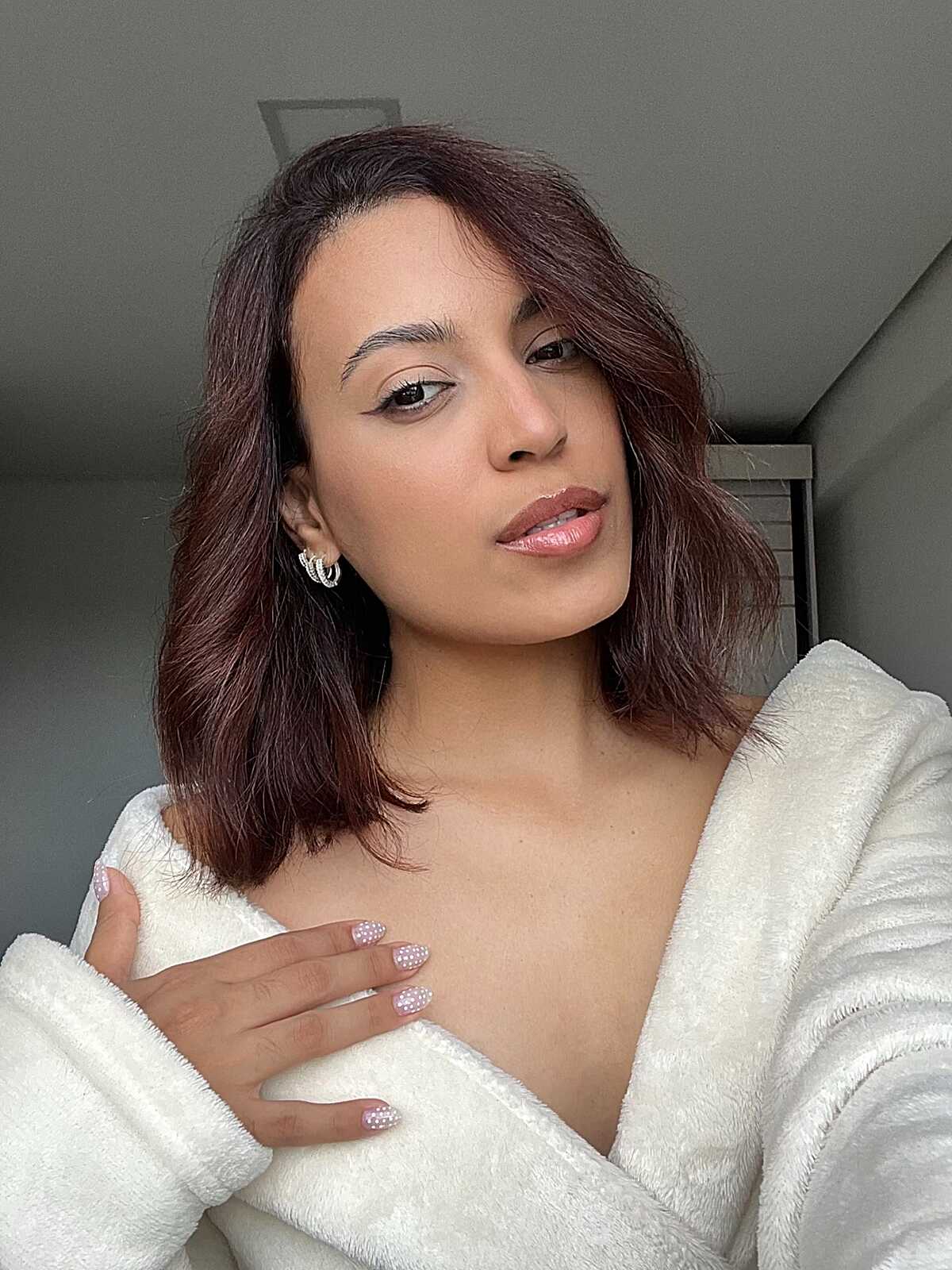 Reddish brown tousled lob with soft waves
