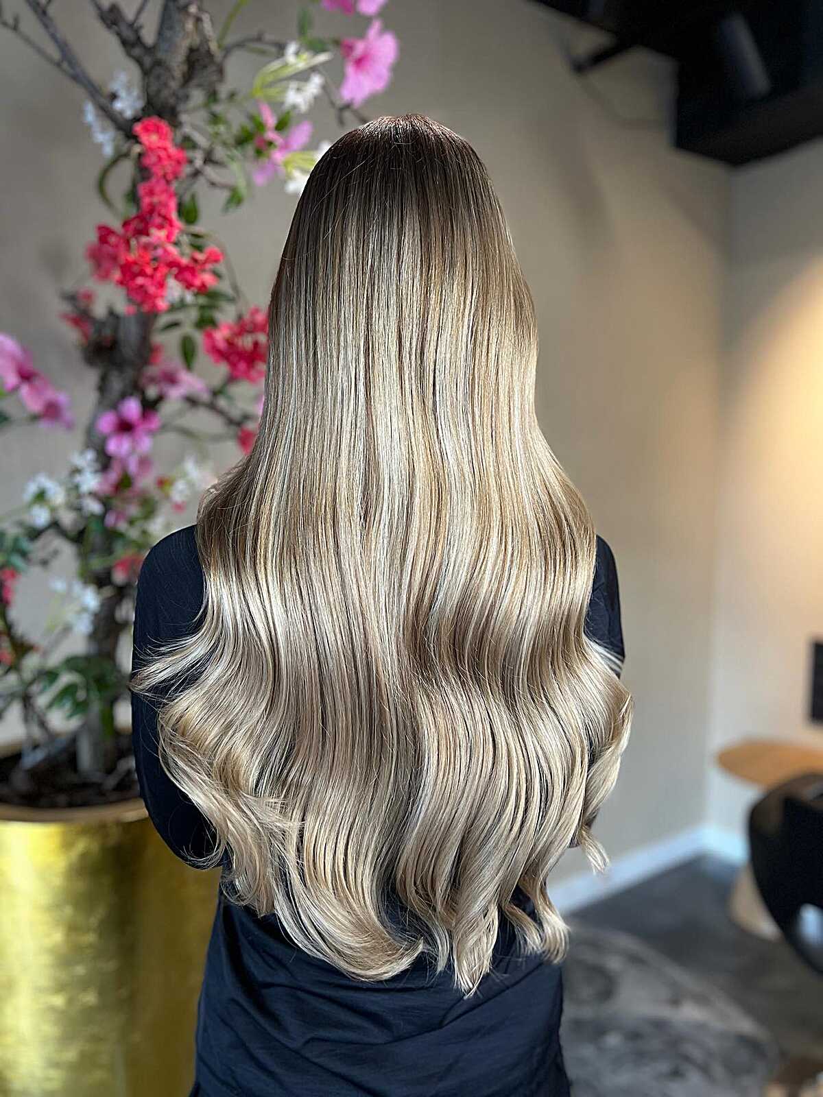 Ultra-long sleek blonde ombré balayage with soft bend