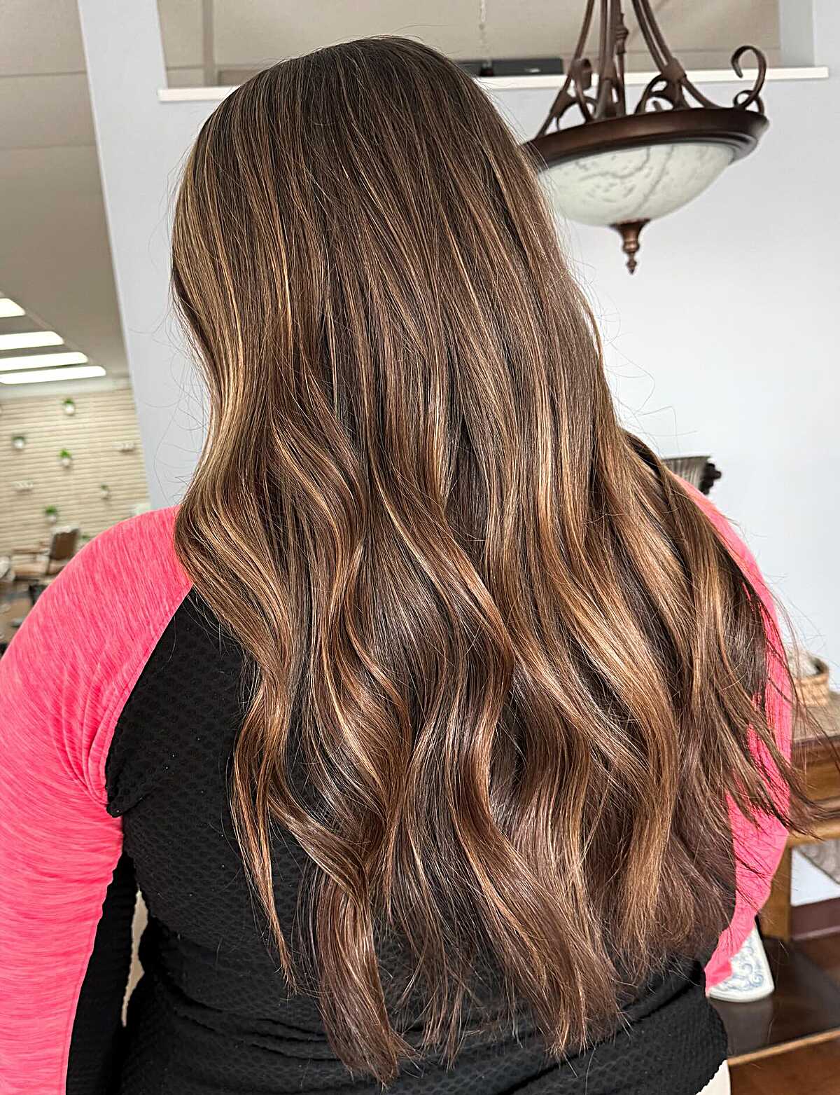 Long chestnut brown hair with caramel balayage ribbons