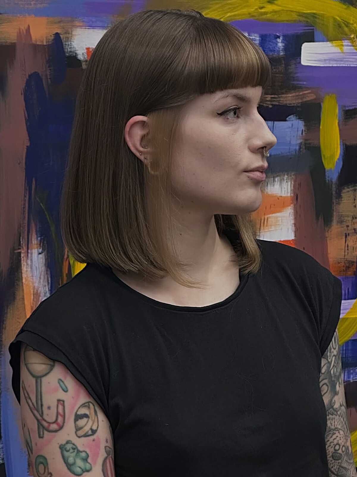 Straight light brown blunt lob with heavy bangs