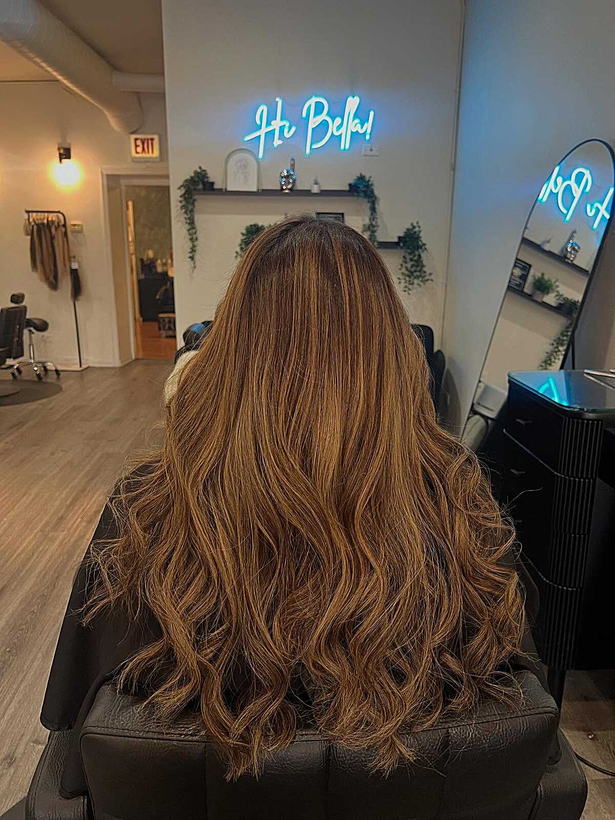 Long warm toffee brown balayage with loose beachy waves