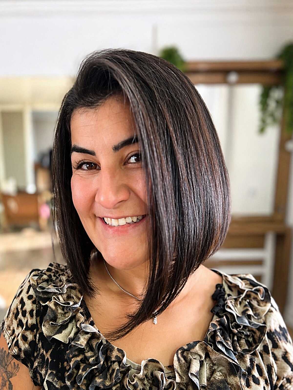 Super sleek angled dark lob with high shine