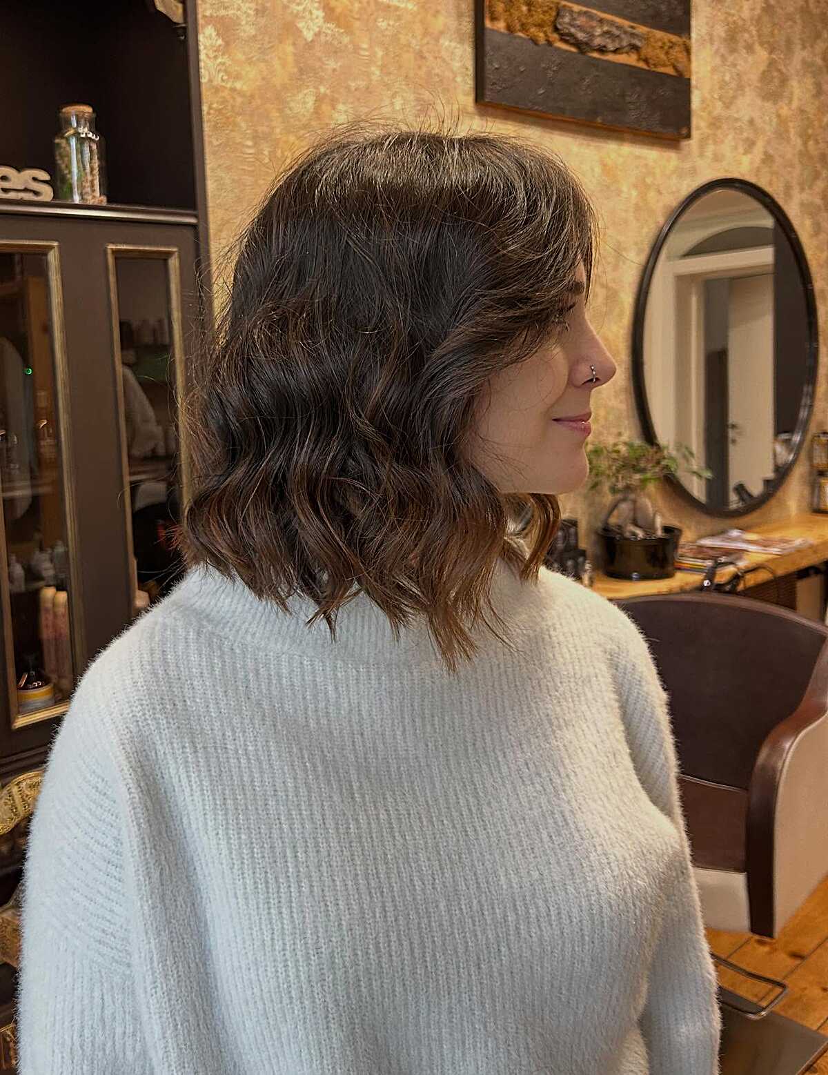 Wavy dark brown lob with curtain fringe from behind