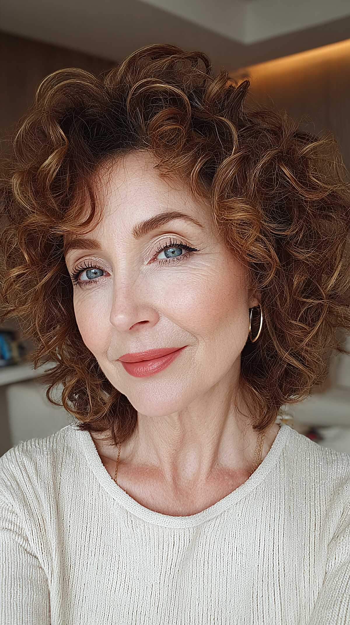 Bouncy short auburn curls with defined layered shape