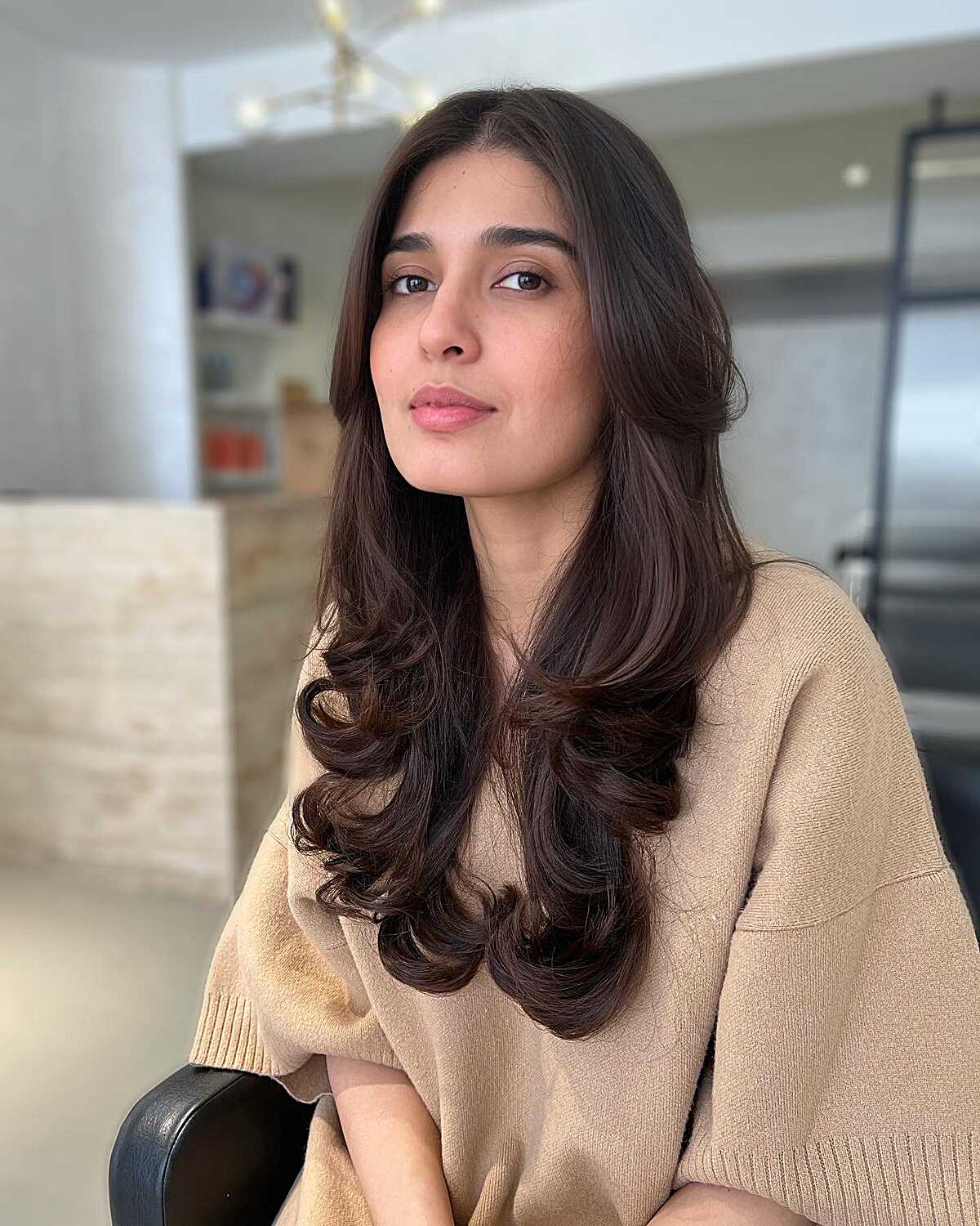 Rich brunette long layers with bouncy curled ends