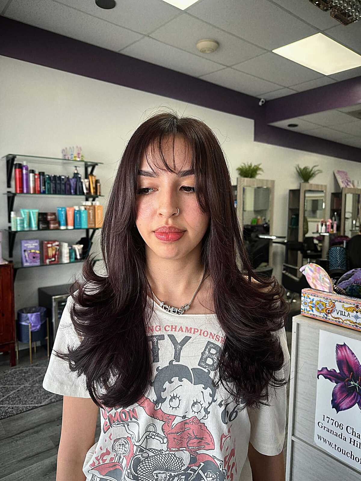Dark brunette long layers with wispy curtain bangs