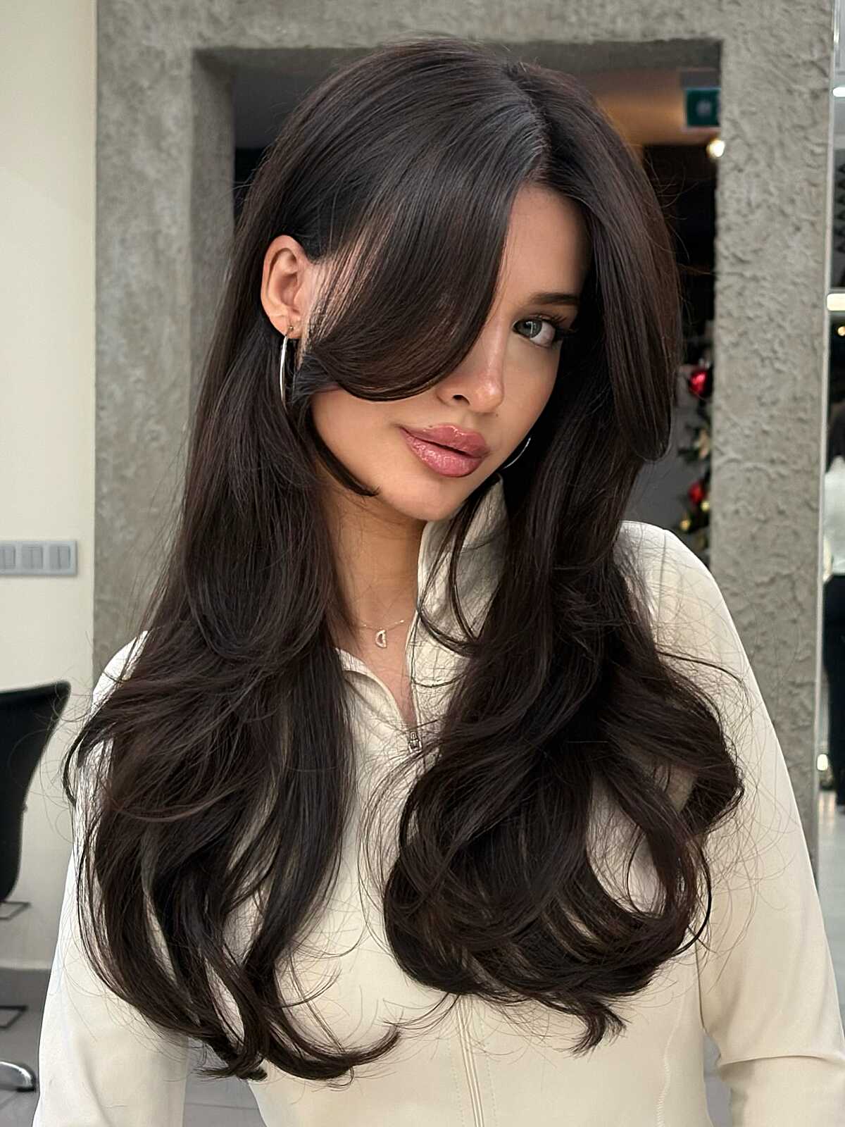 Long dark espresso hair with side-swept curtain bangs