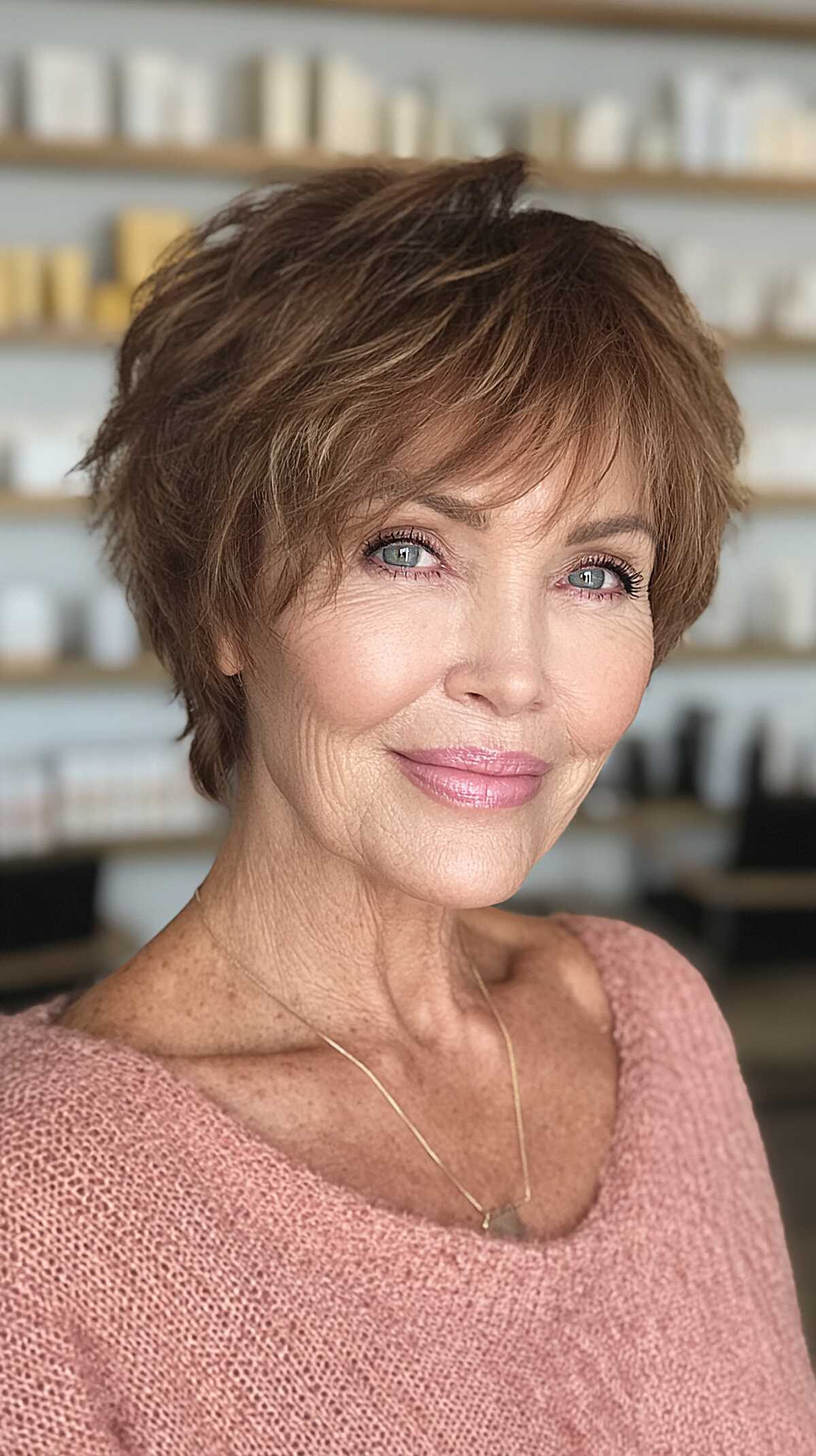 Feathered light brown short shag with wispy bangs