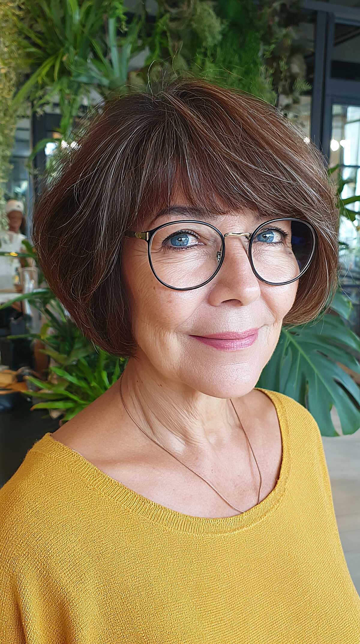 Full Brunette Bob with Soft Bangs and Round Glasses