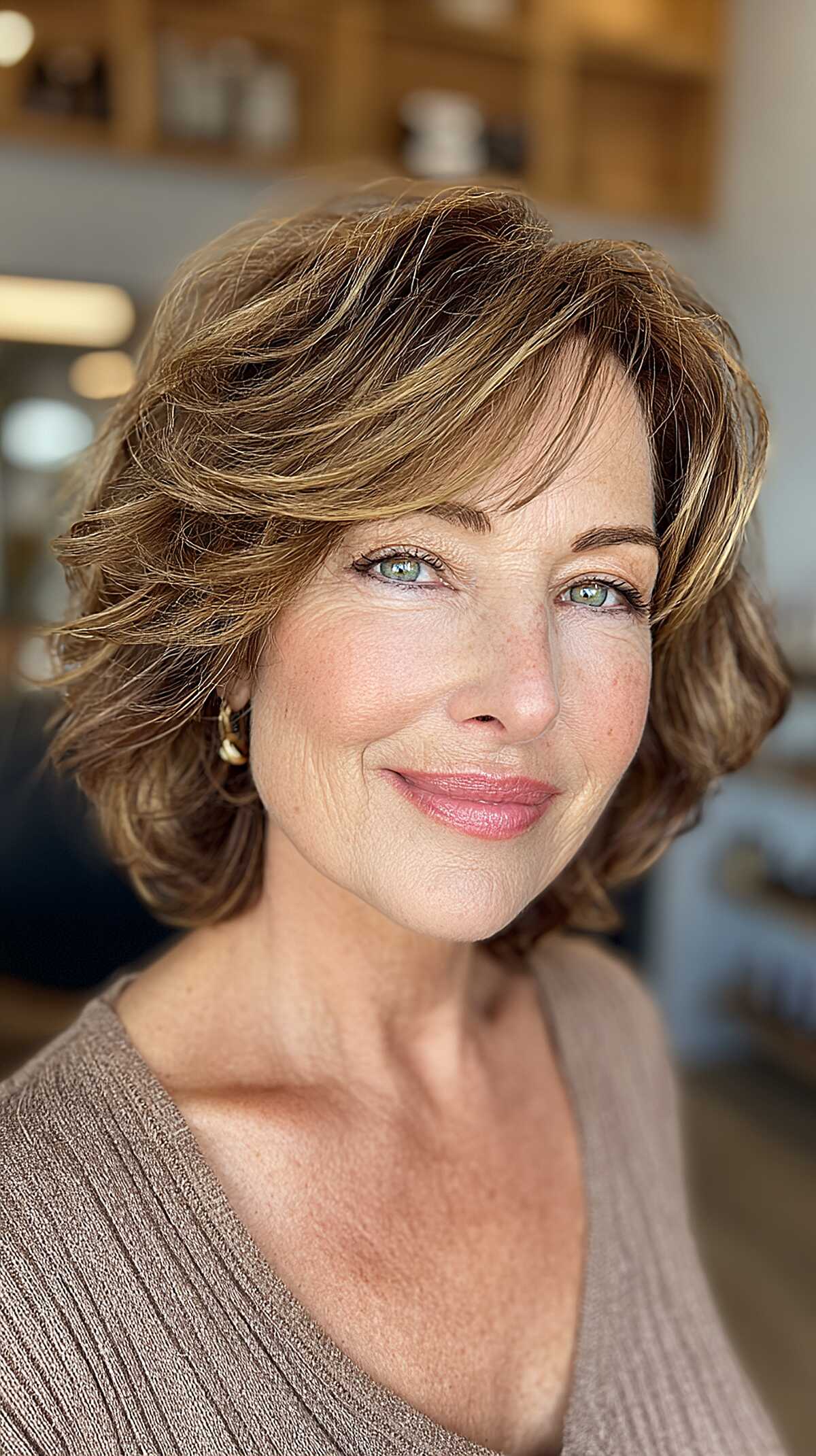 Highlighted brunette bob with voluminous curled layers