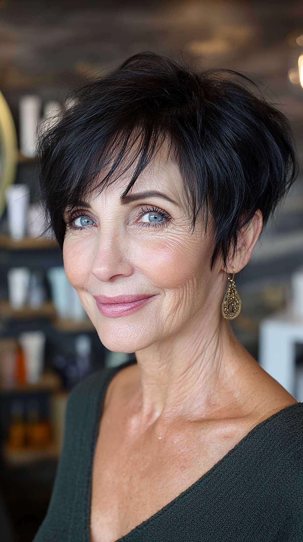 Inky black layered pixie with long sweeping side fringe