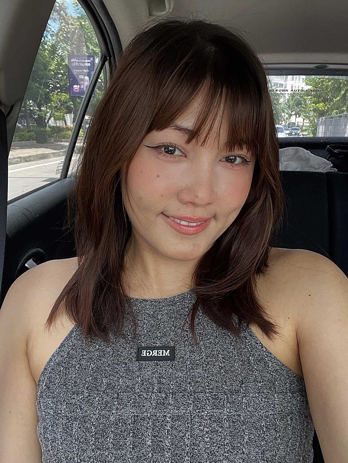 Layered Brunette Shag with Feathered Bangs