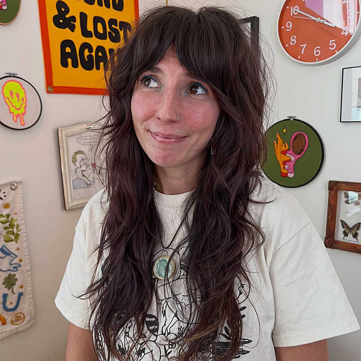Dark wavy shag with curtain bangs and messy texture