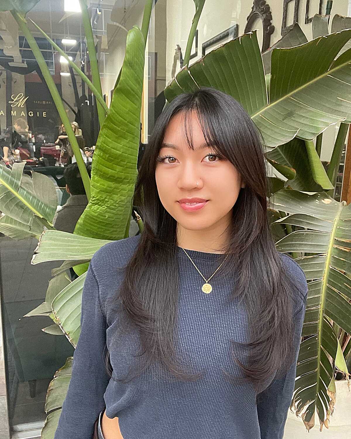 Long straight black hair with soft curtain bangs