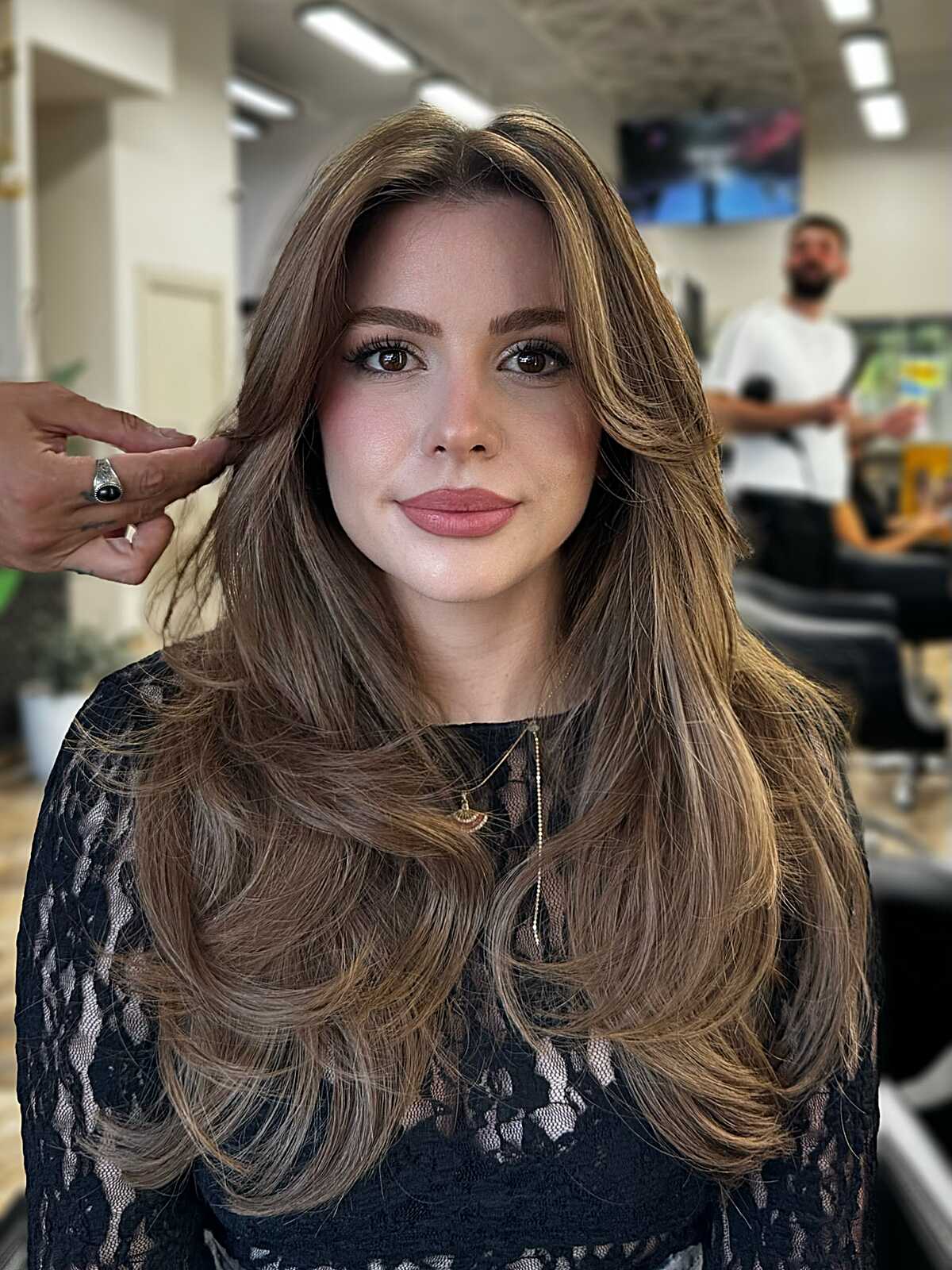 Bronde long layered hair with feathered curtain bangs