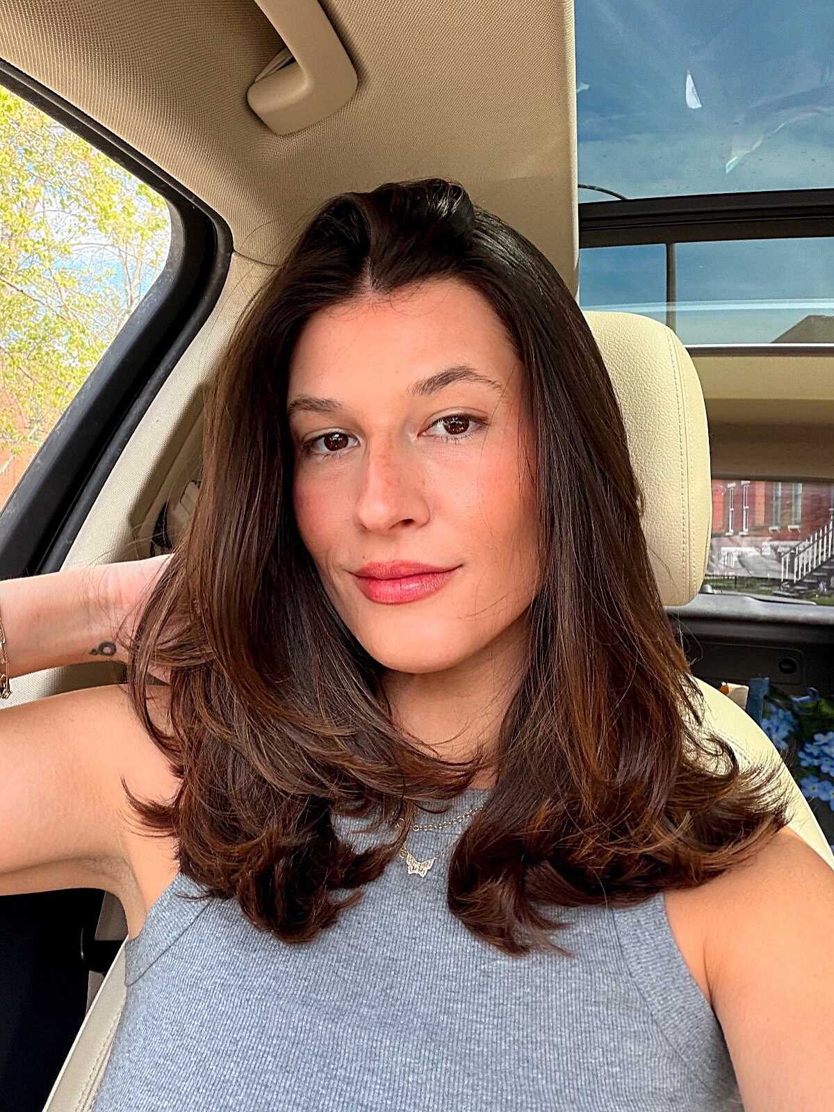 Voluminous Brunette Blowout with Middle Part