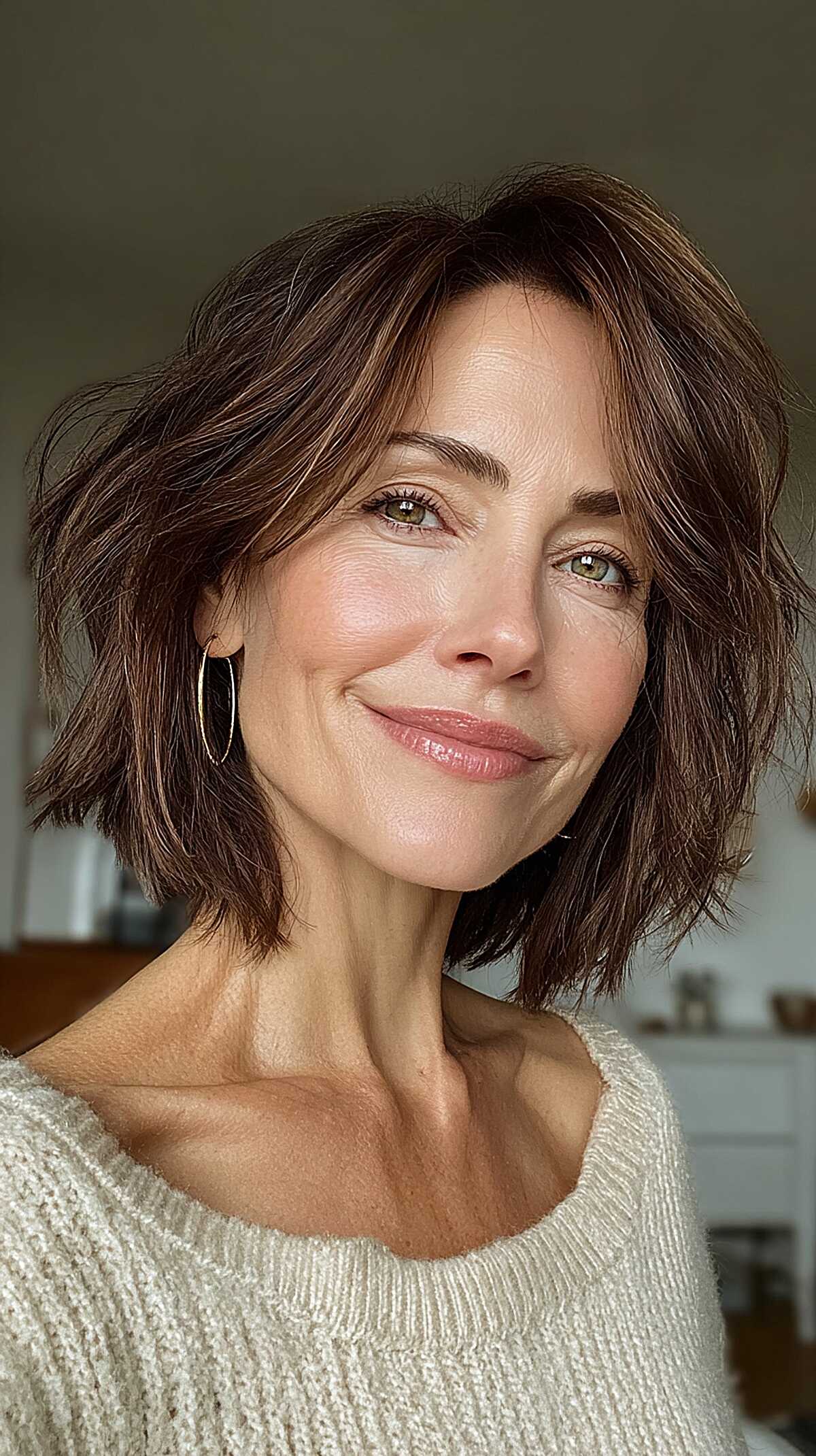 Warm brown choppy bob with piece-y ends and volume