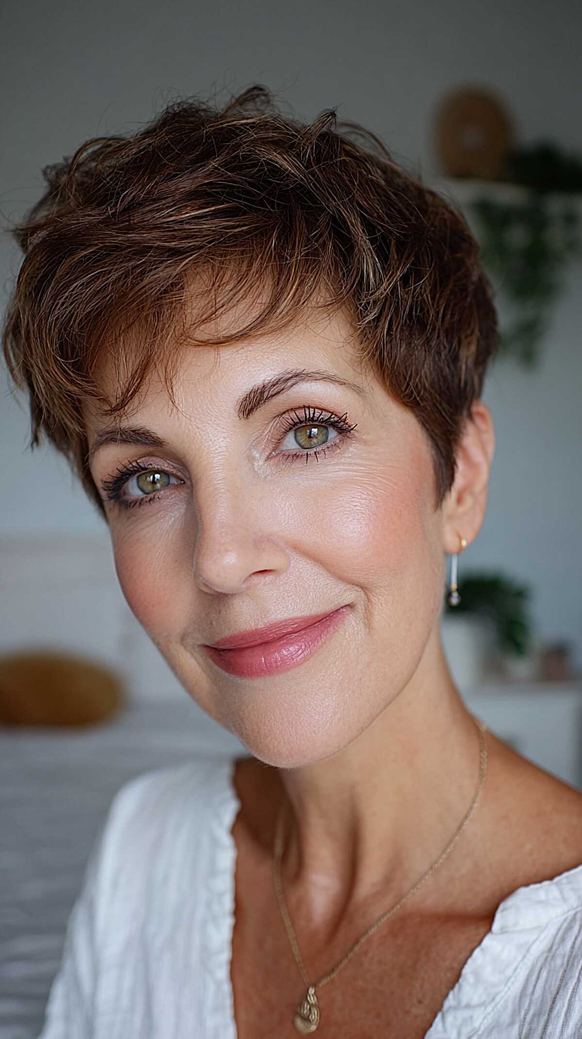 Warm brown curly pixie with natural wavy texture