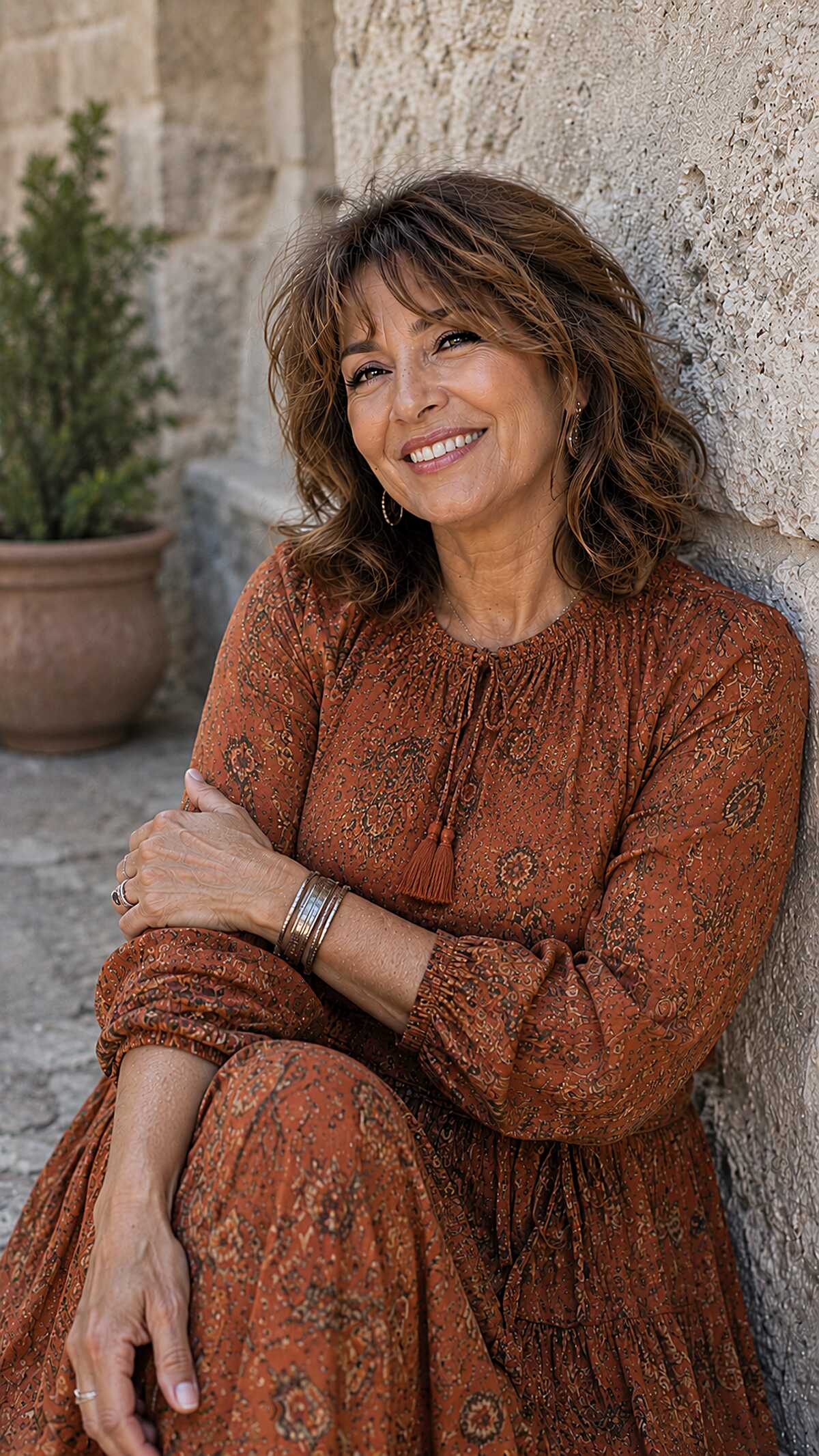 Warm brunette curly shag with feathered bangs over 60