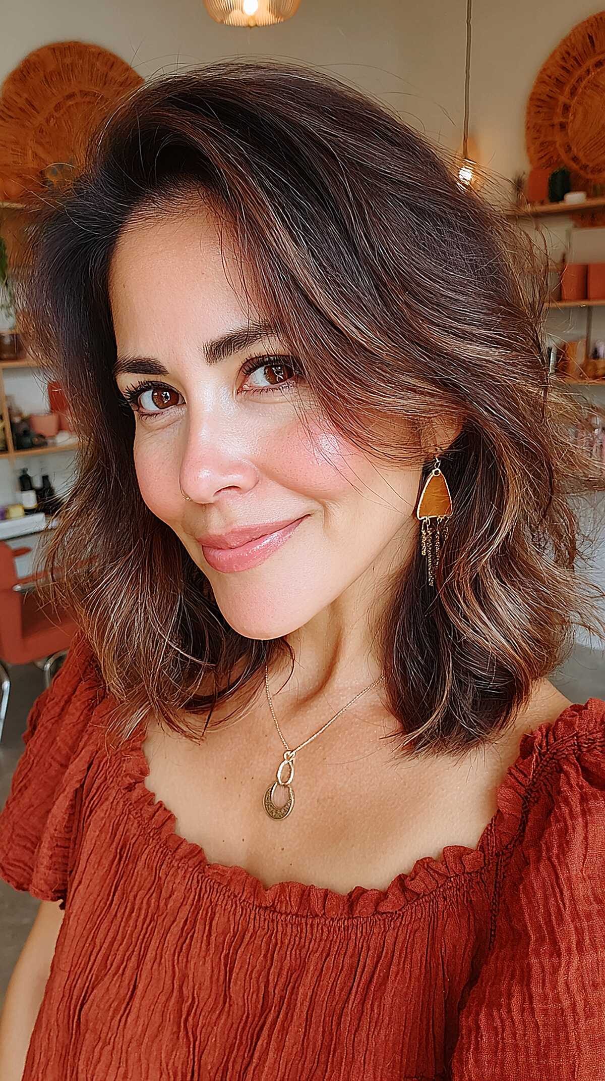 Warm brunette textured lob with caramel ends