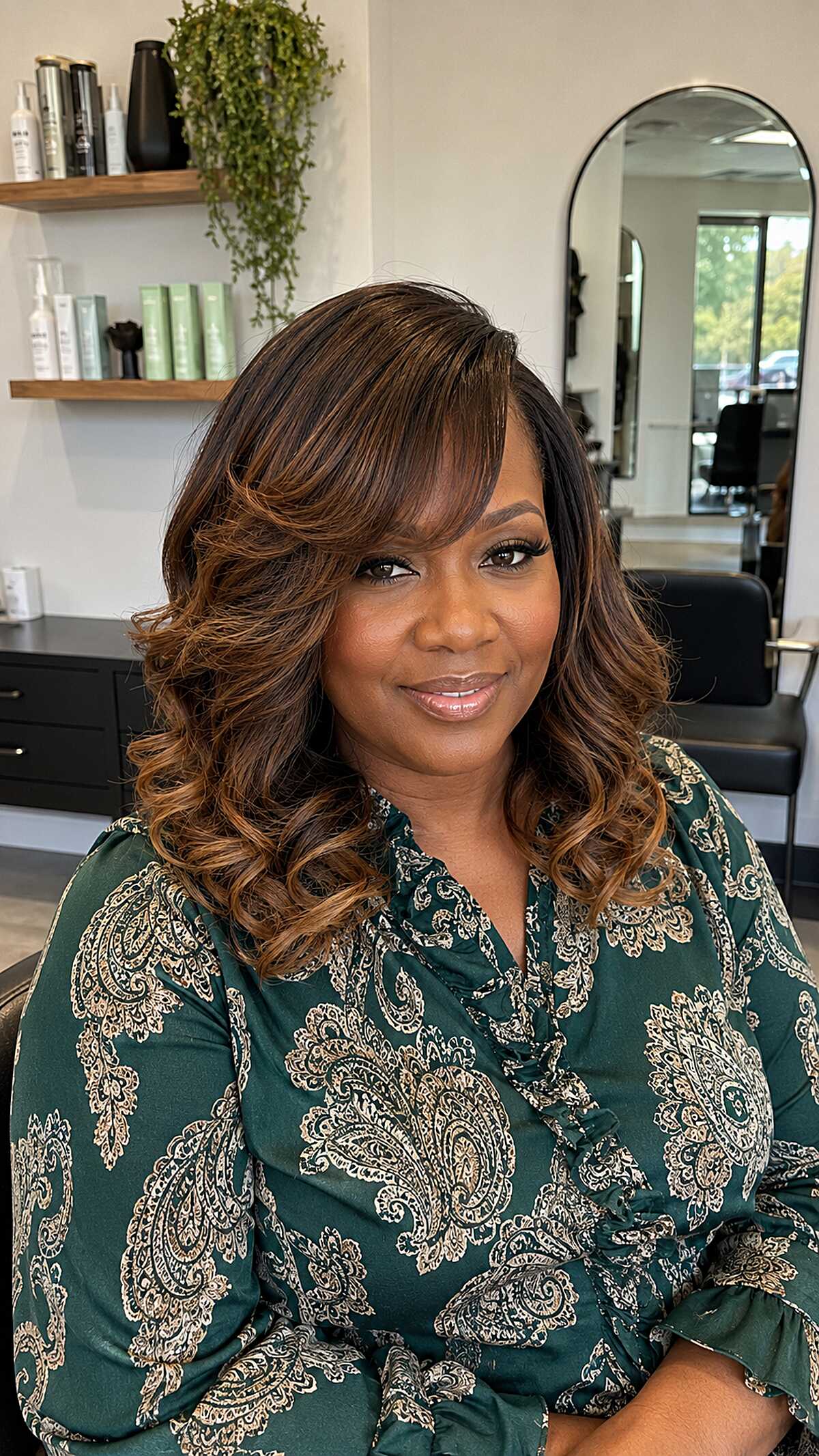 Medium quick weave with chocolate brown curls and honey tips