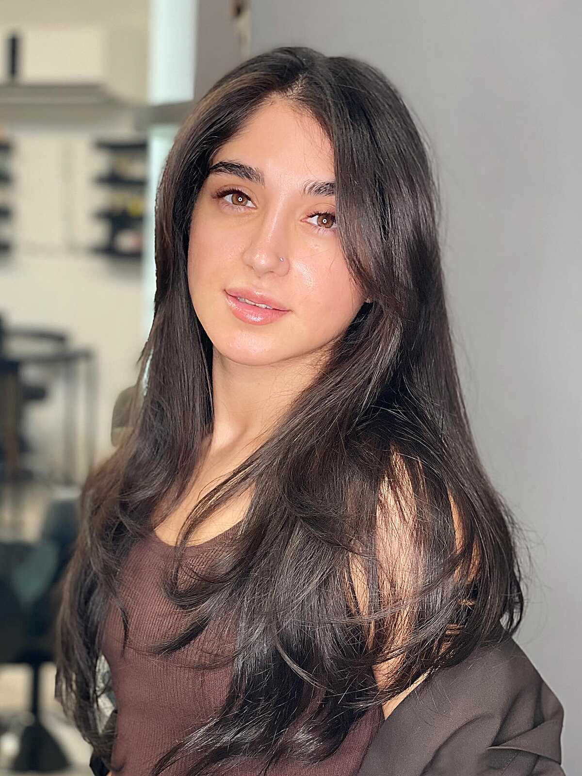 Long dark brunette hair with soft barely-there curtain fringe