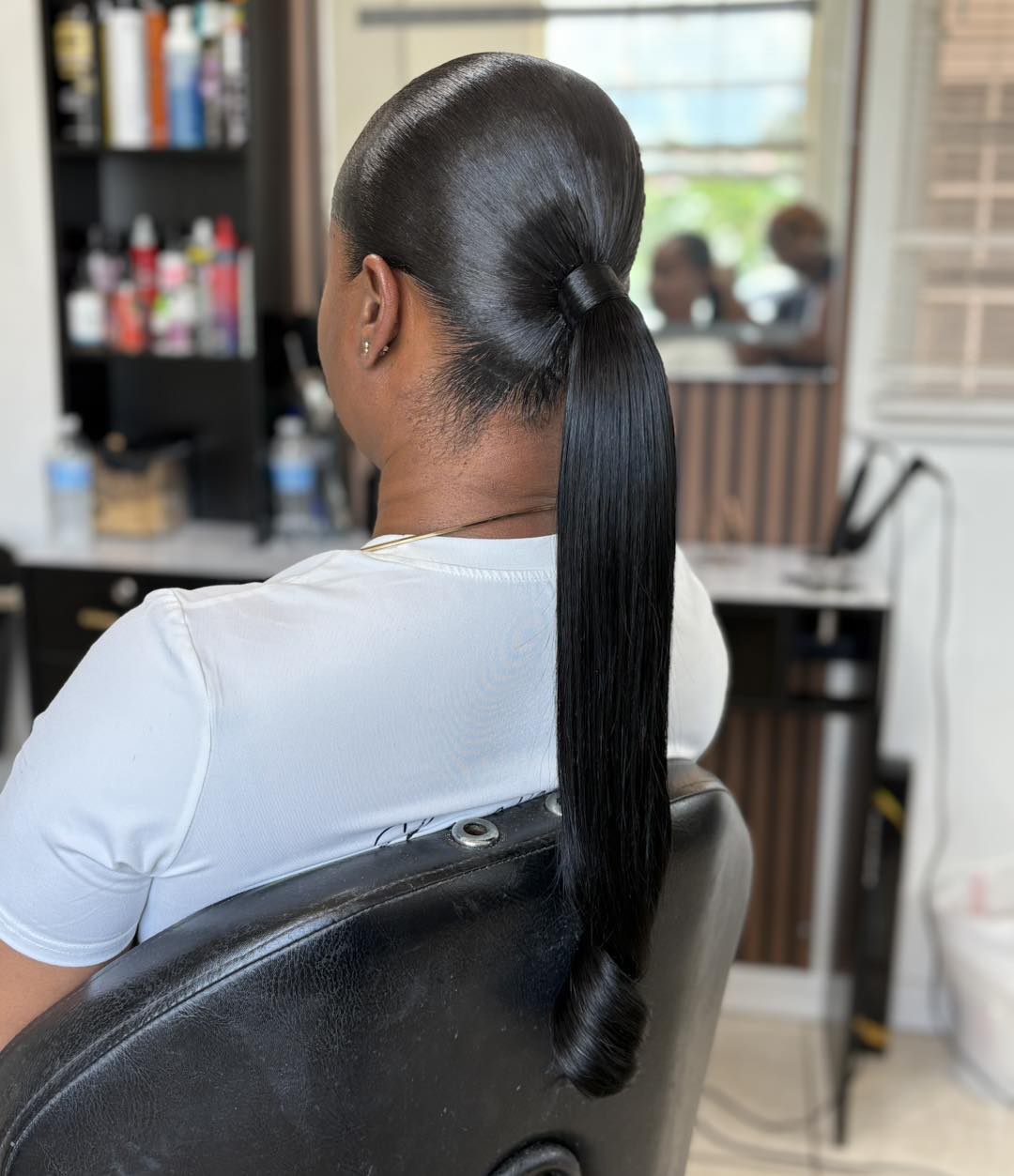 Extra-Long Sleek Ponytail with Single Curled Tip