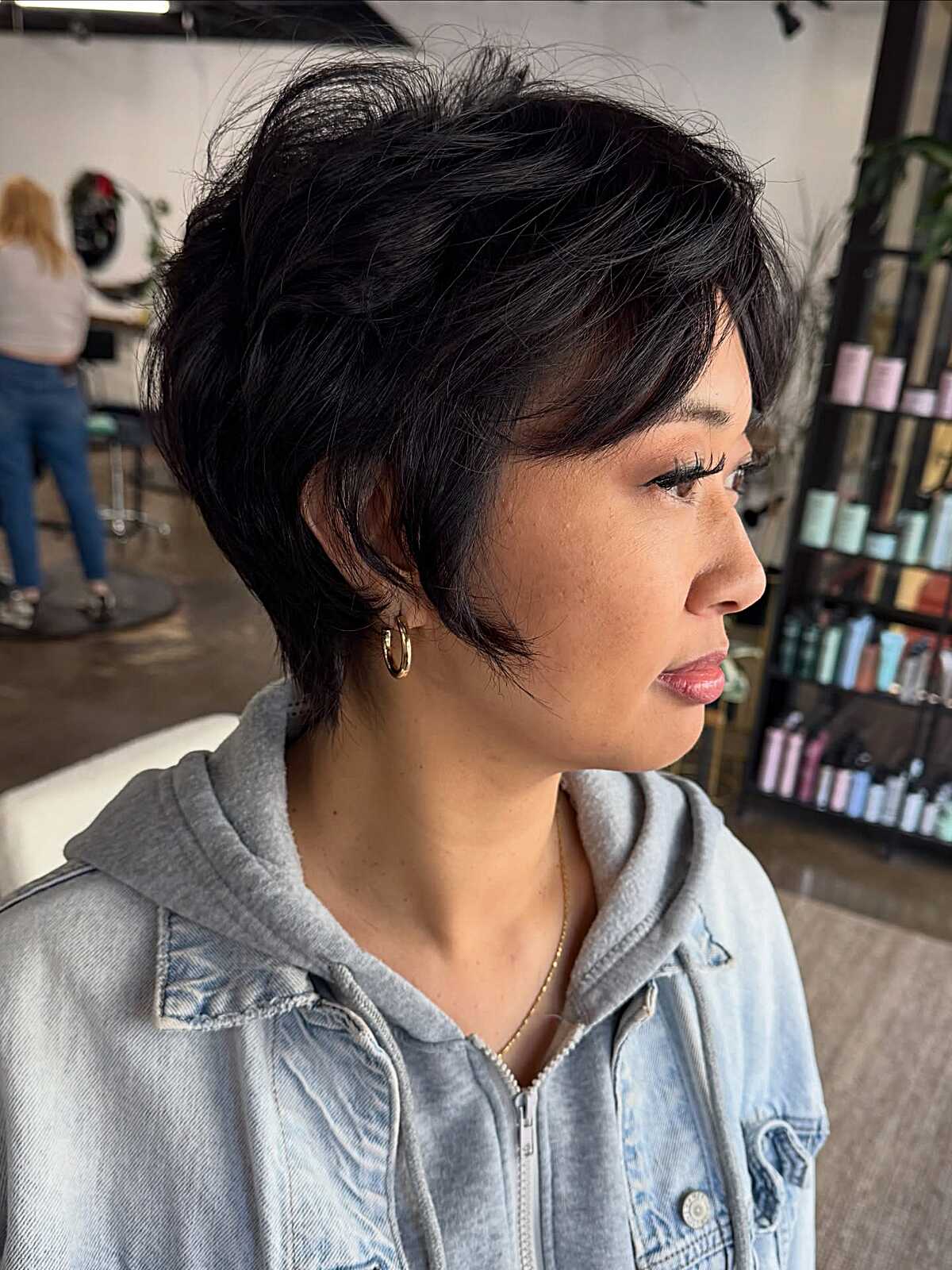 Feathered dark pixie cut with textured piecey layers