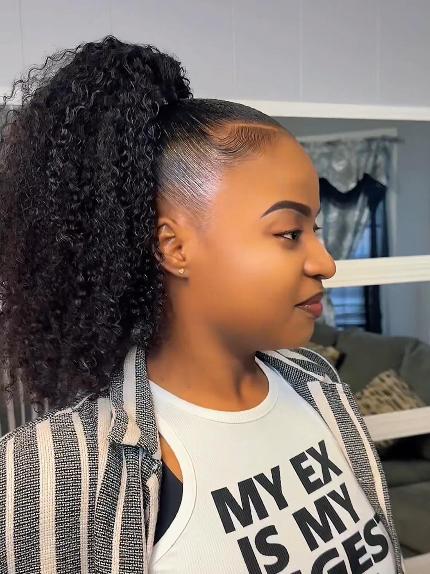 High Curly Ponytail with Defined Tight Curl Pattern