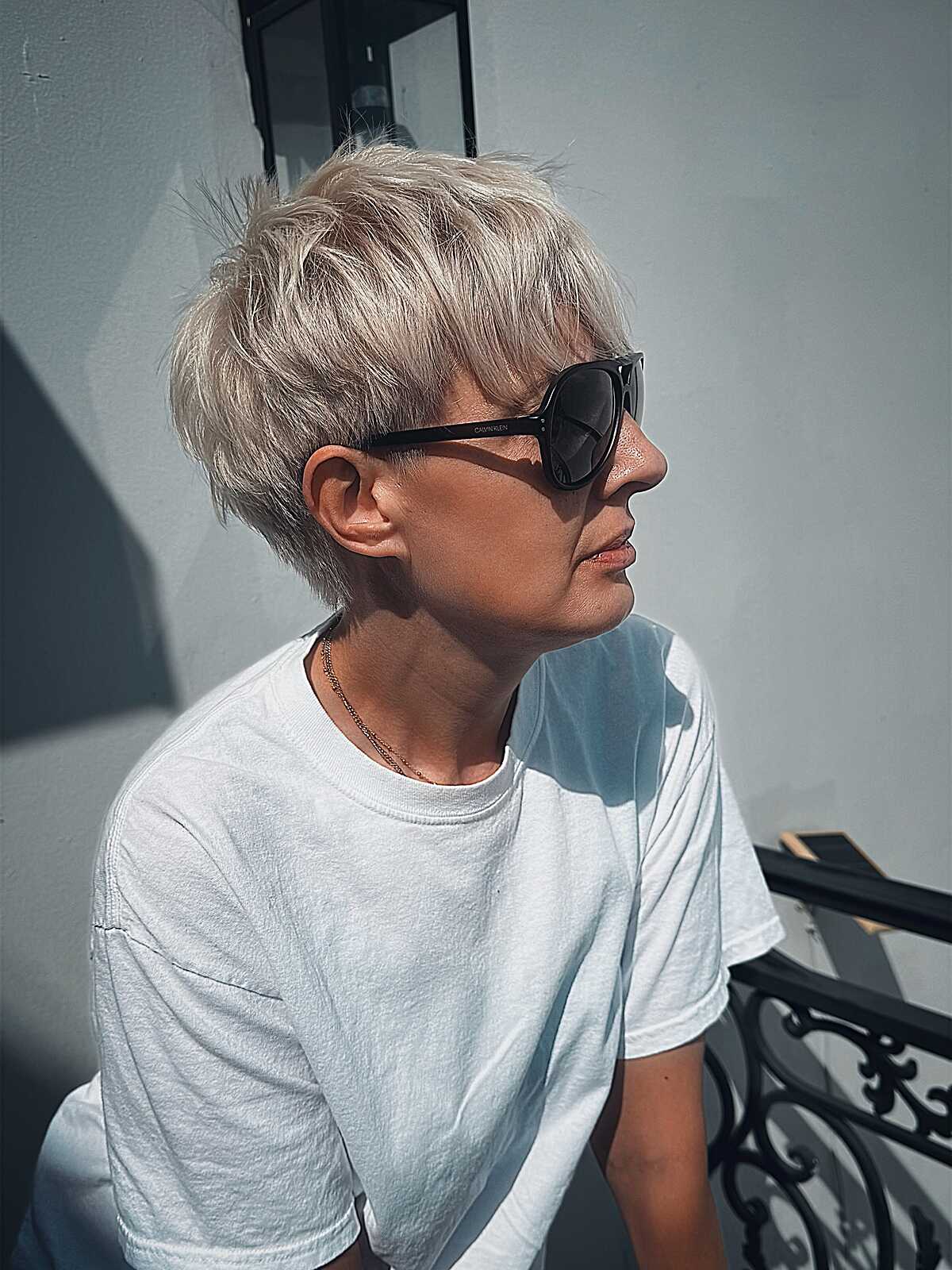 Icy platinum blonde choppy textured fluffy pixie