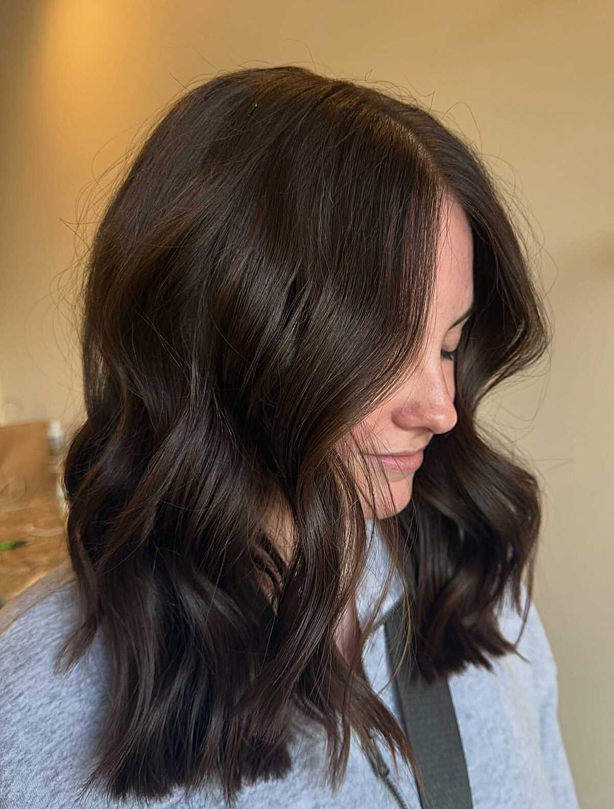 Rich espresso brown wavy mid length with subtle movement