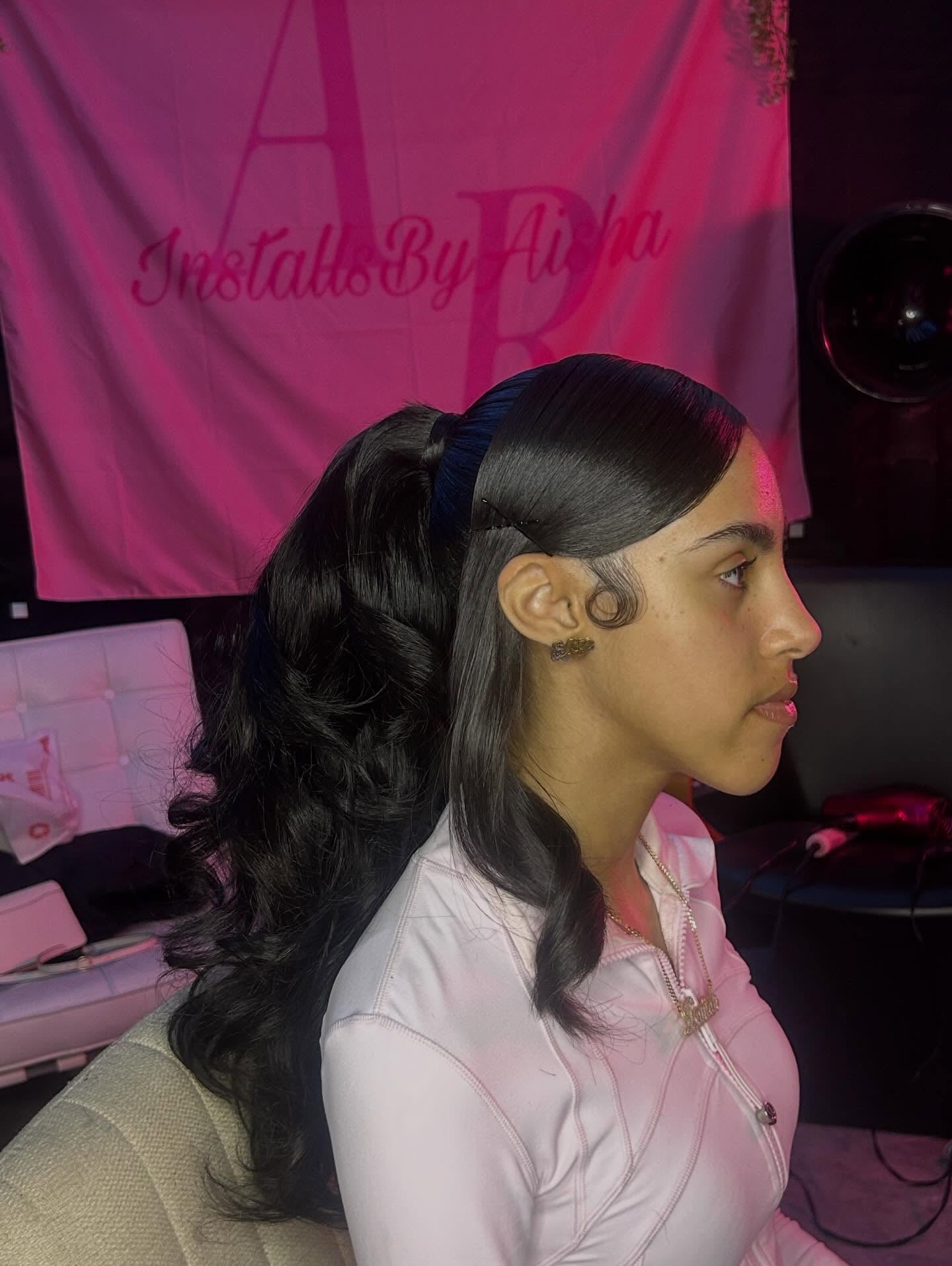 Sleek Ponytail with Barrel Curls and Swirled Baby Hair