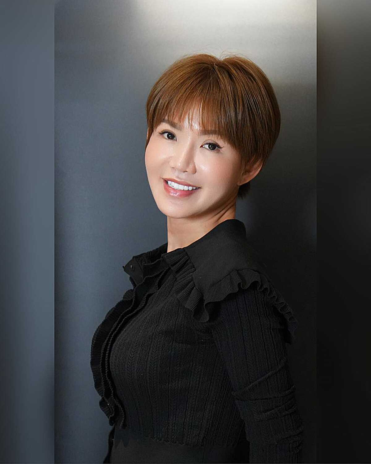 Smooth warm copper pixie with soft rounded bangs