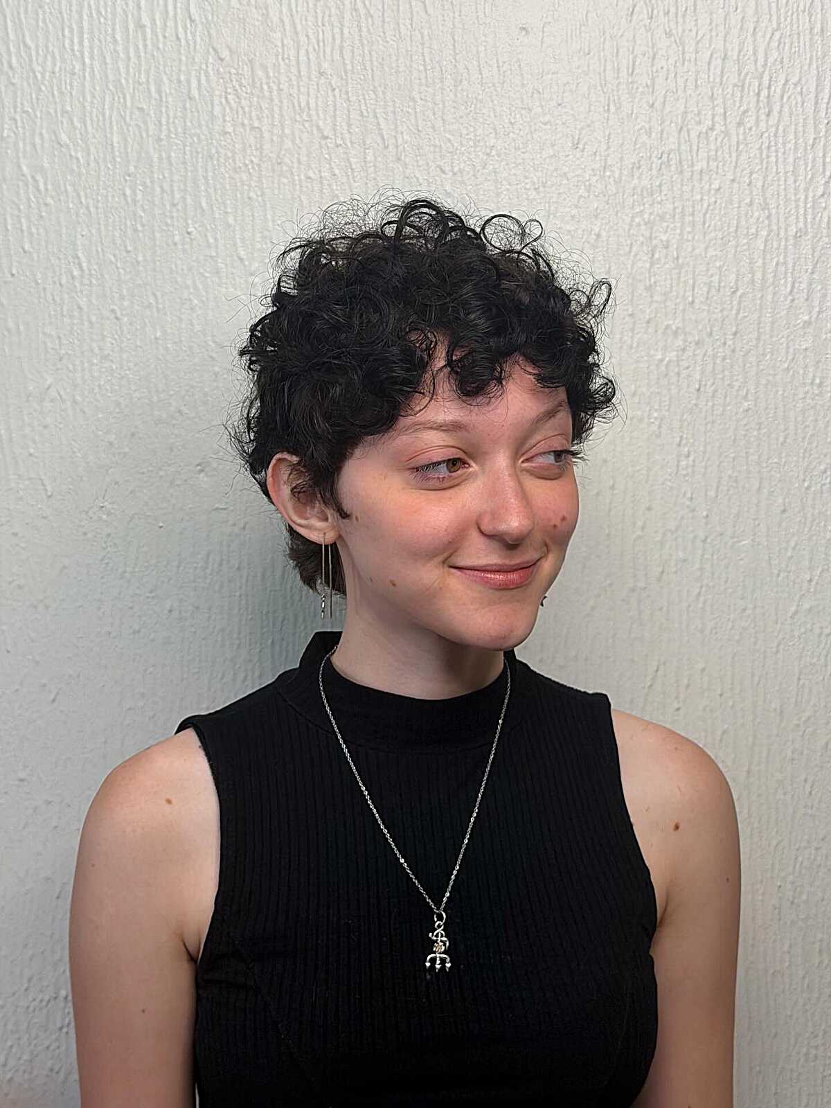 Short black curly pixie with springy bouncy curls