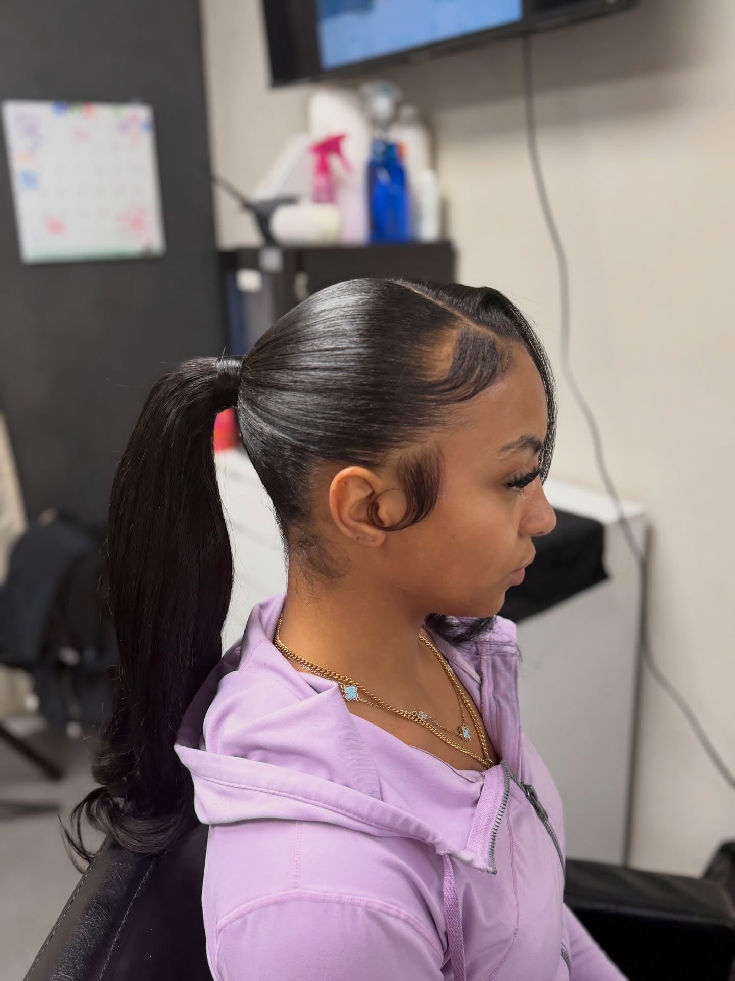 Swooped Mid-Height Ponytail with Straight Silk Press