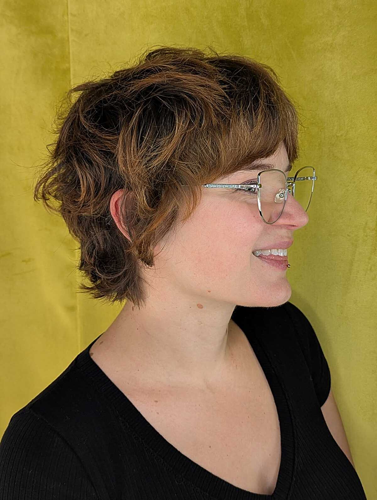 Wavy shaggy pixie with warm copper brown highlights