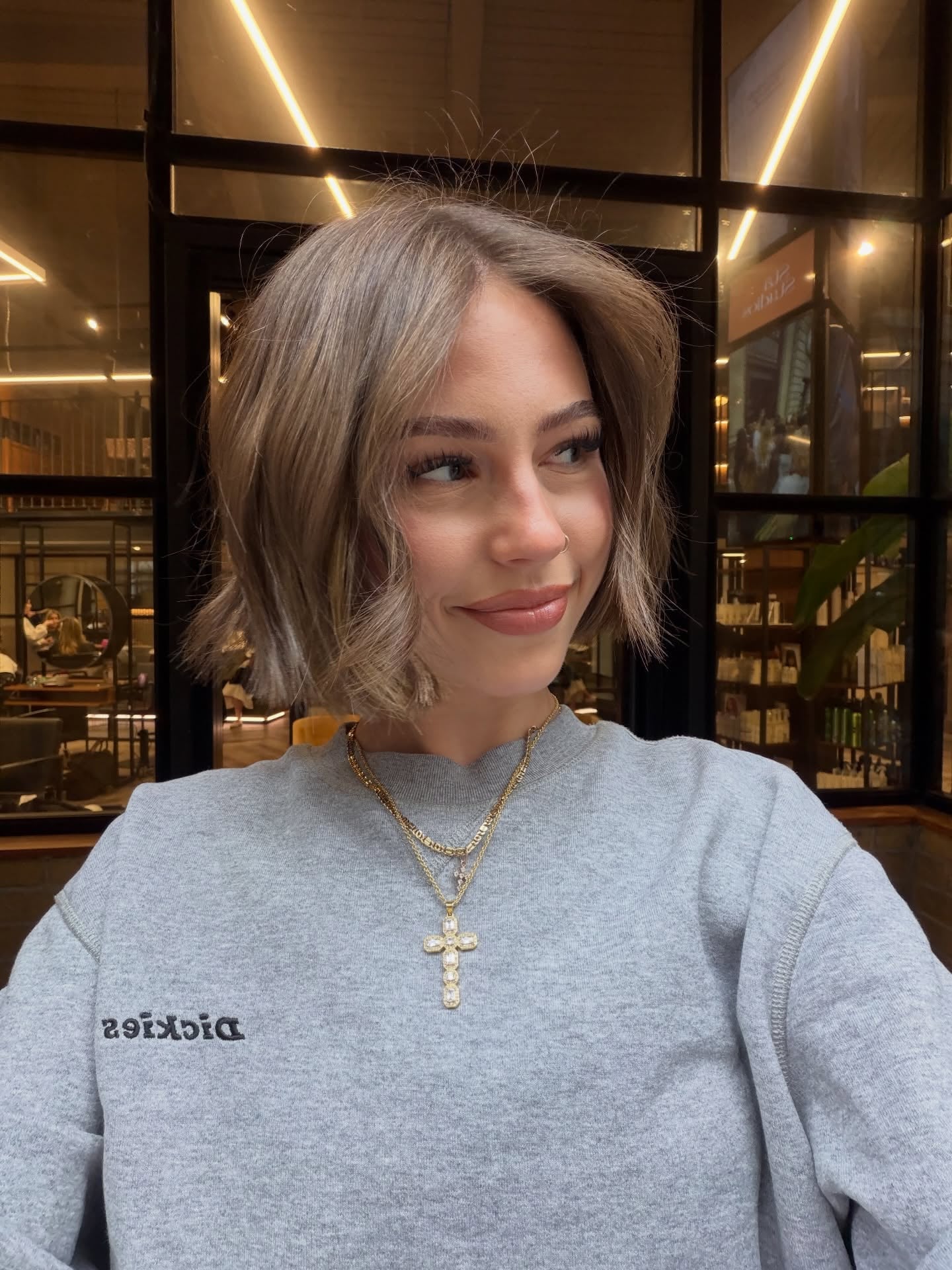 Tousled chin-length ash bronde bob with side part