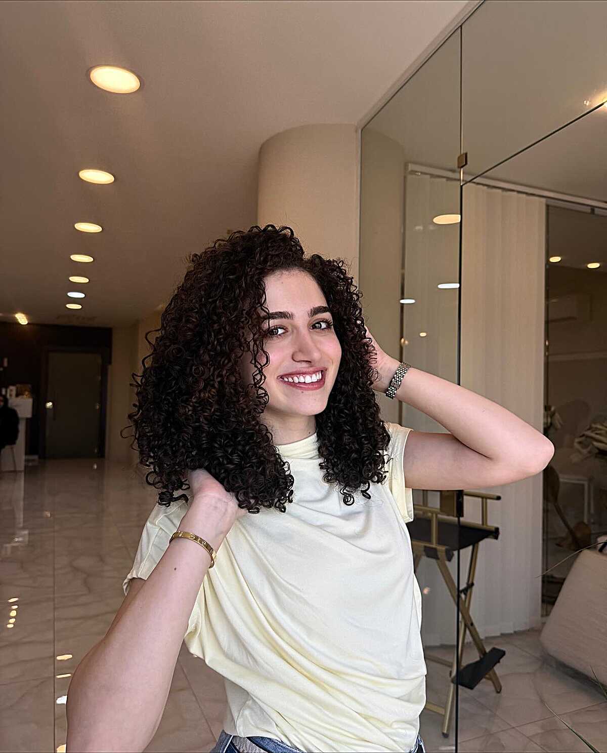 Bouncy Voluminous Dark Curls Past Shoulders
