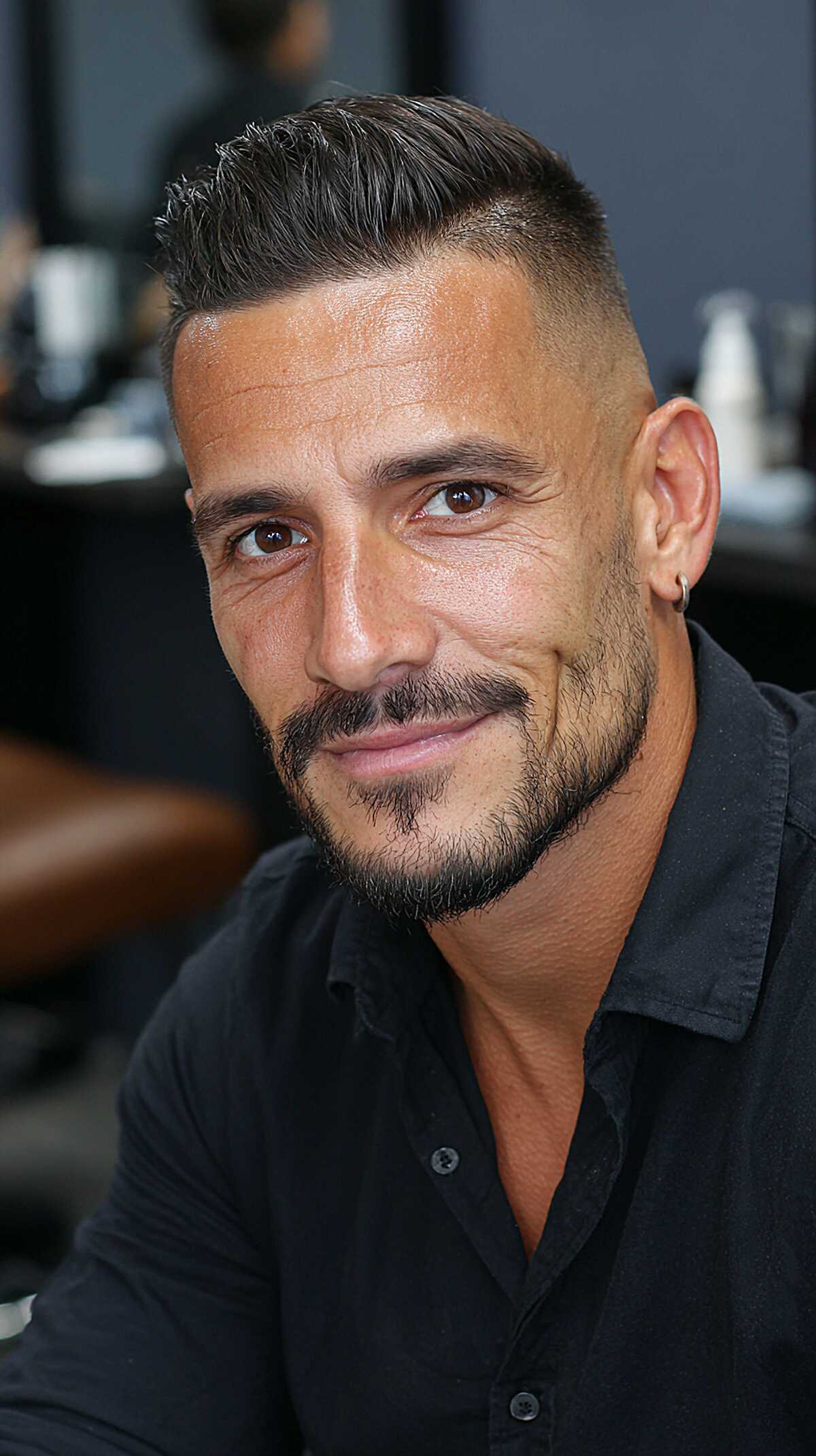 Brushed back top with a sharp skin fade and stubble