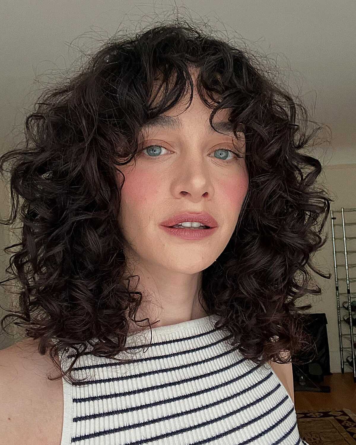 Dark Curly Lob with Curtain Bangs