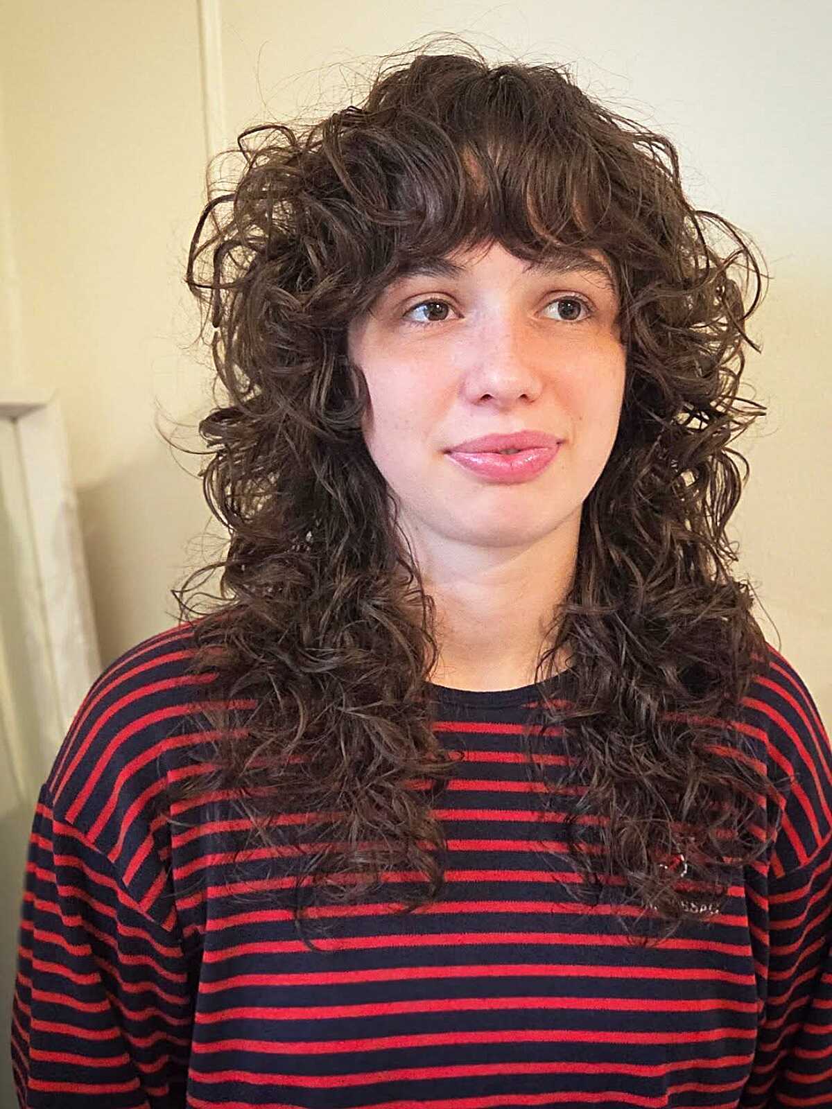 Brunette Curly Shag with Soft Wispy Bangs