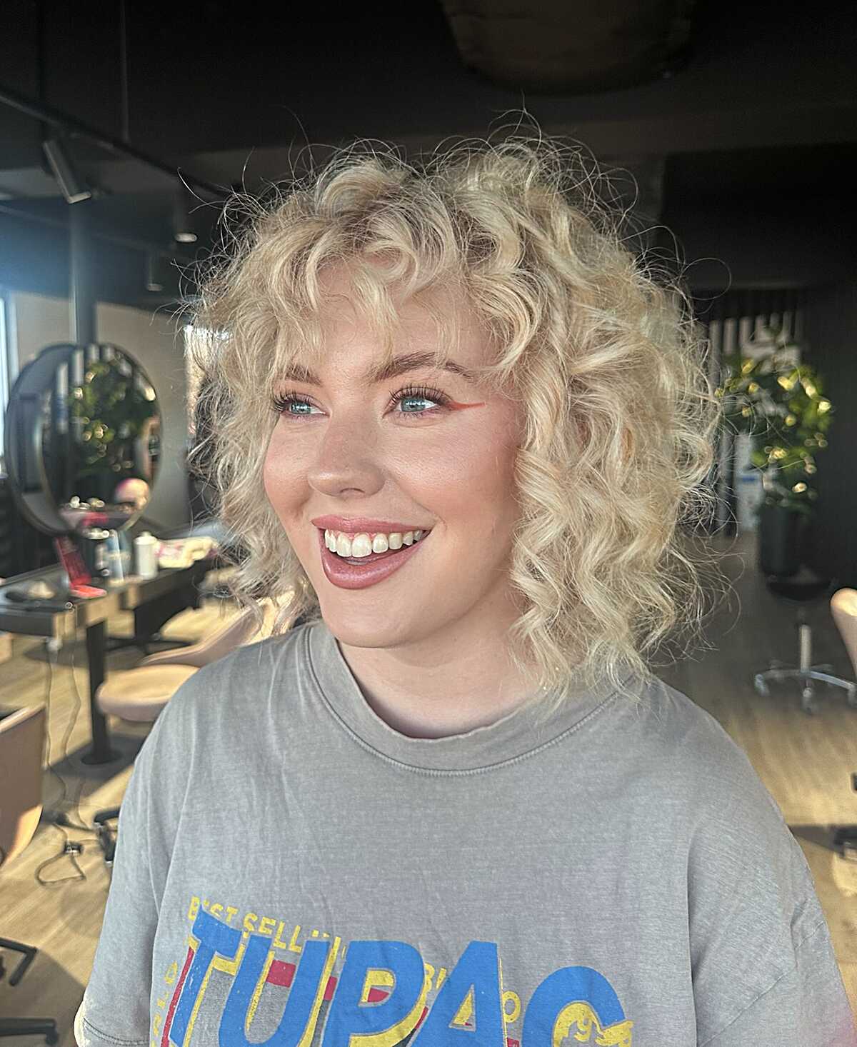 Platinum Blonde Curly Bob with Tousled Texture
