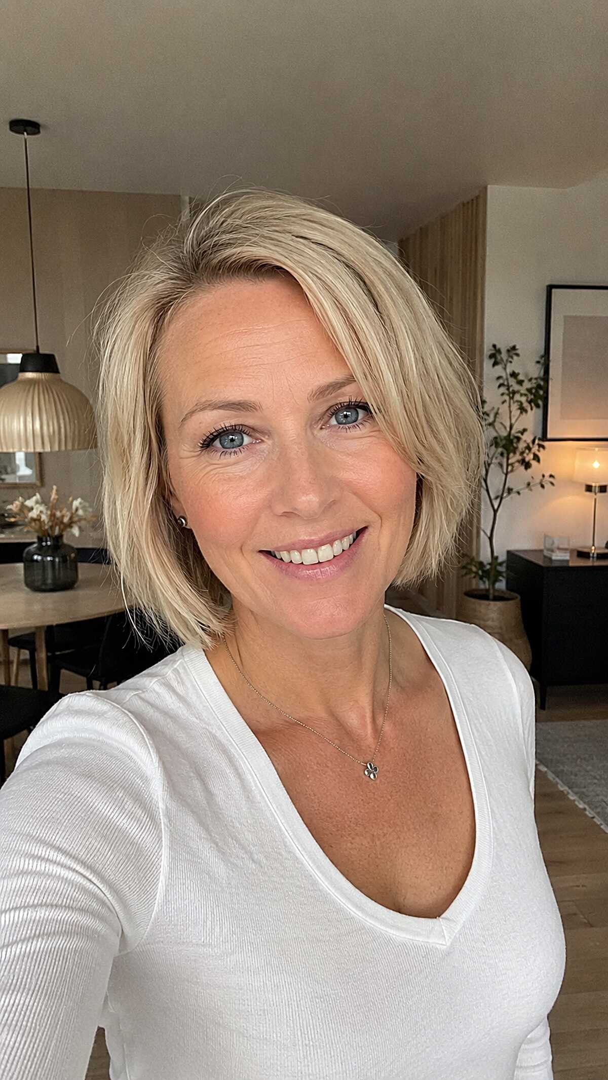 Platinum blonde tucked bob with subtle highlights