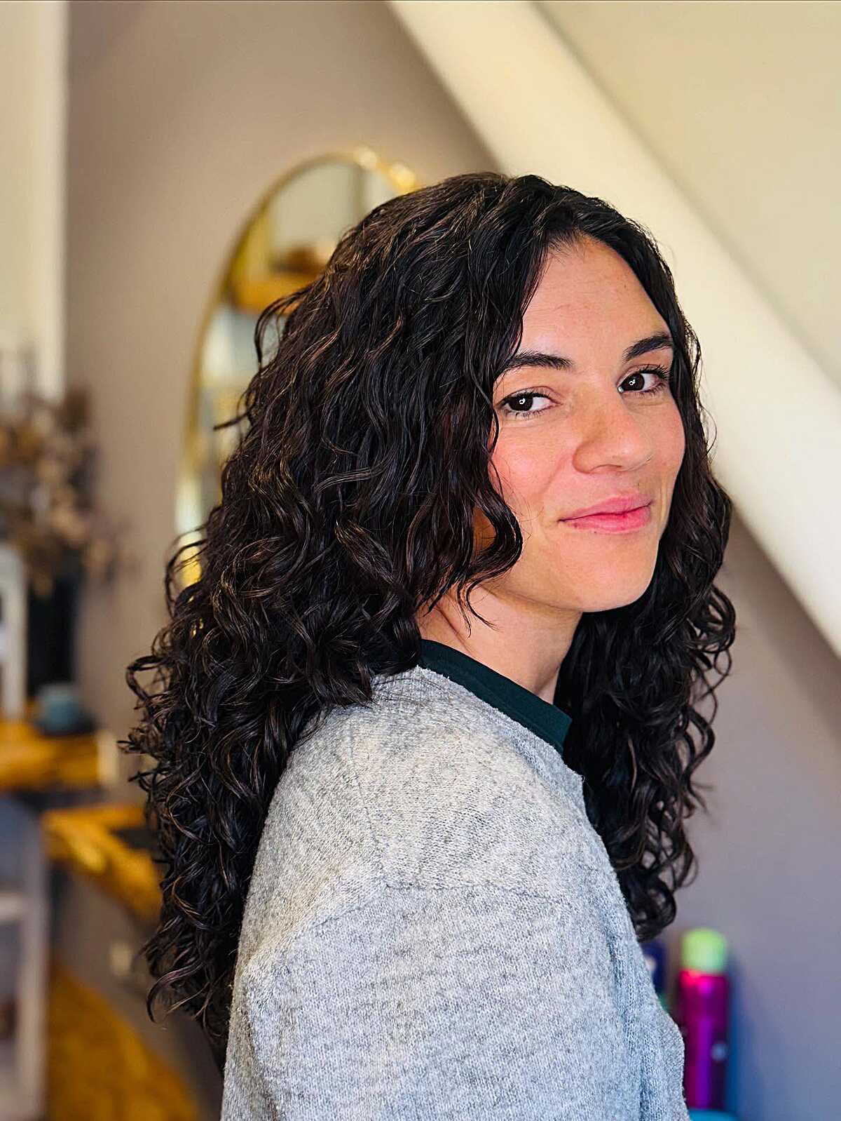 Dark Shoulder-Length Soft Waves with Natural Part
