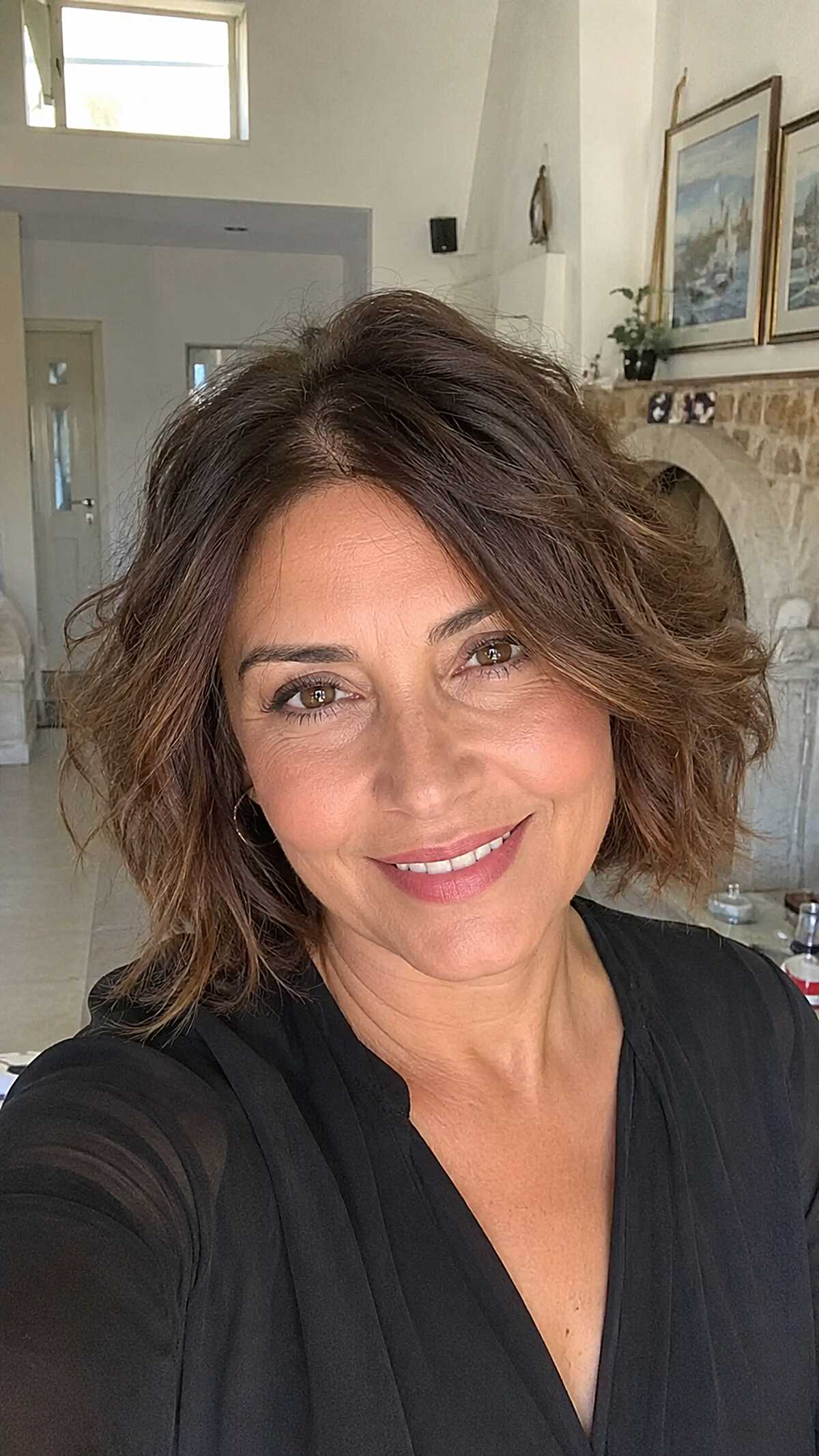 Tousled warm brunette wavy bob with volume