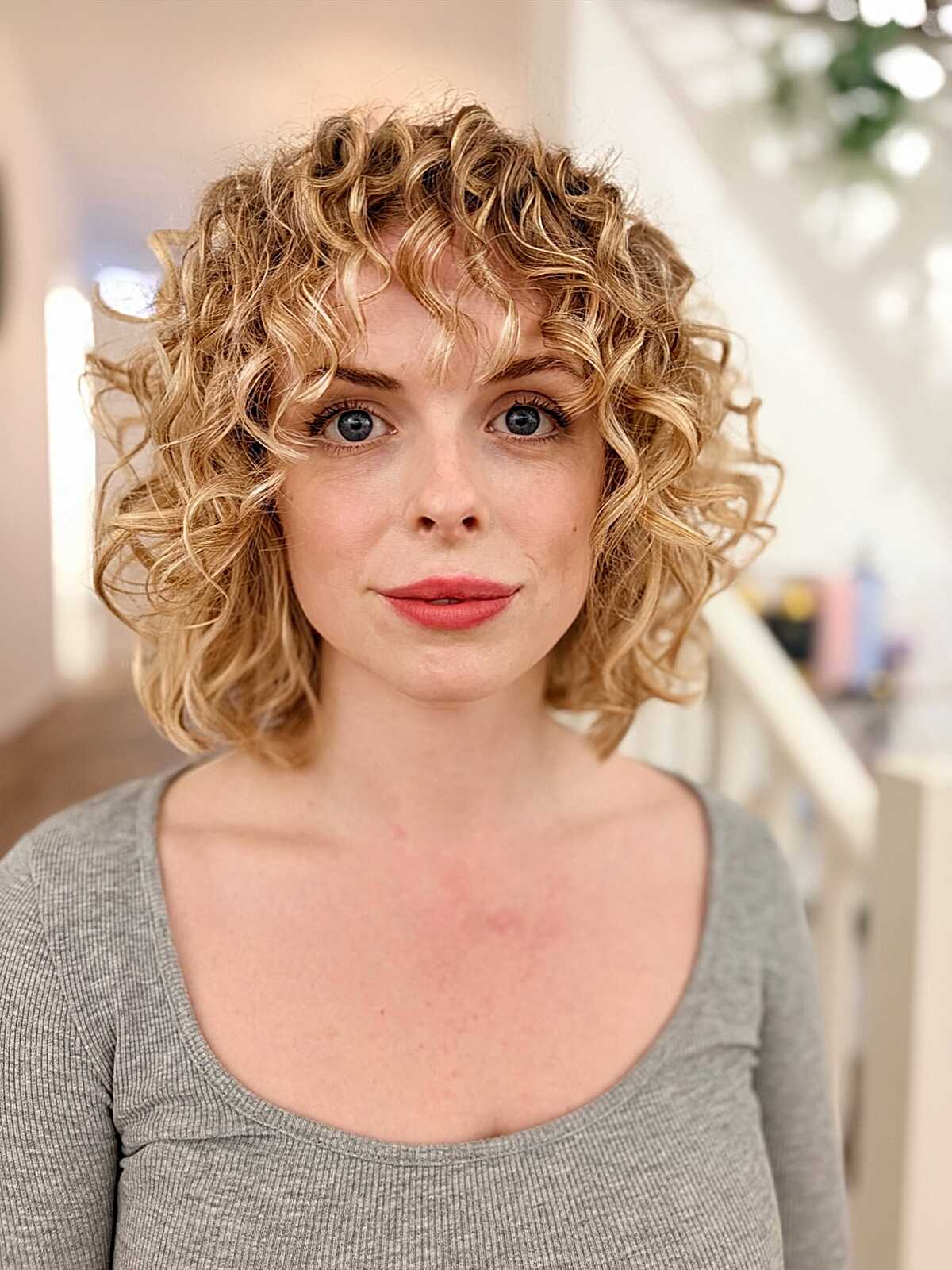 Warm Blonde Curly Bob with Curly Bangs
