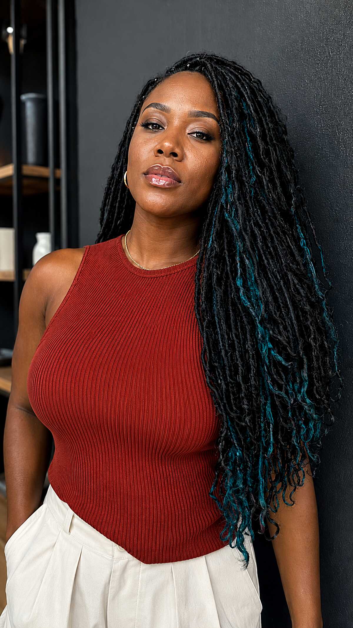 Black Locs with Teal Tips Over One Shoulder
