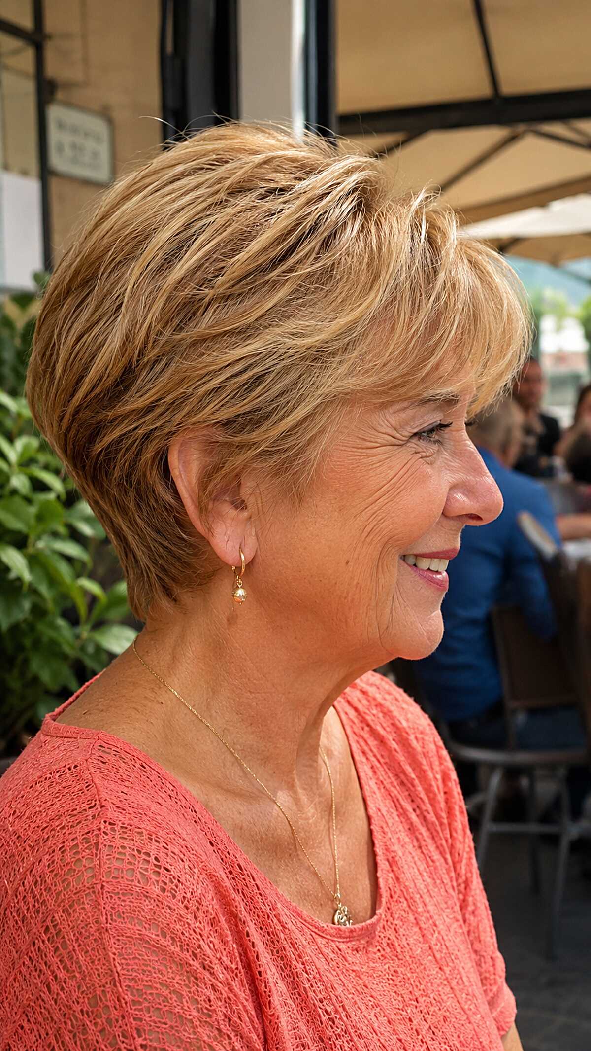 Sandy blonde layered wedge with wispy side bangs