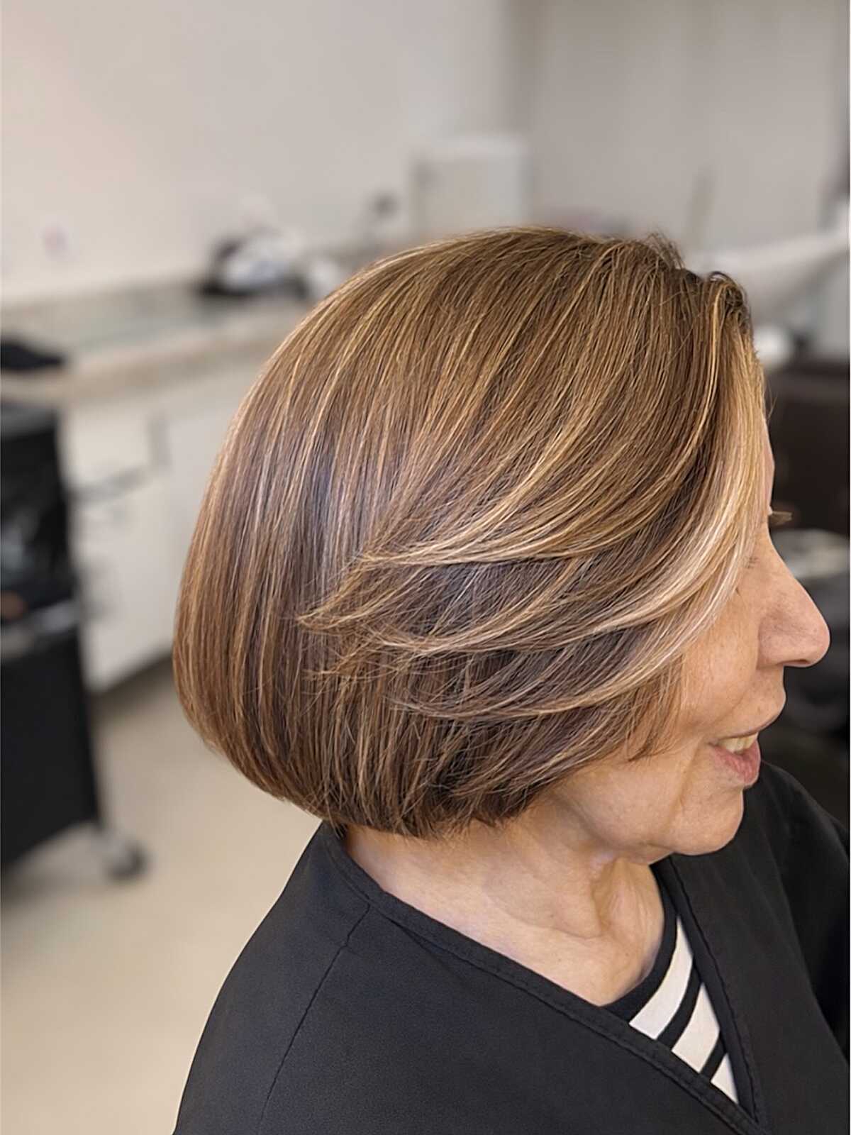 Classic chin-length bob with caramel highlights